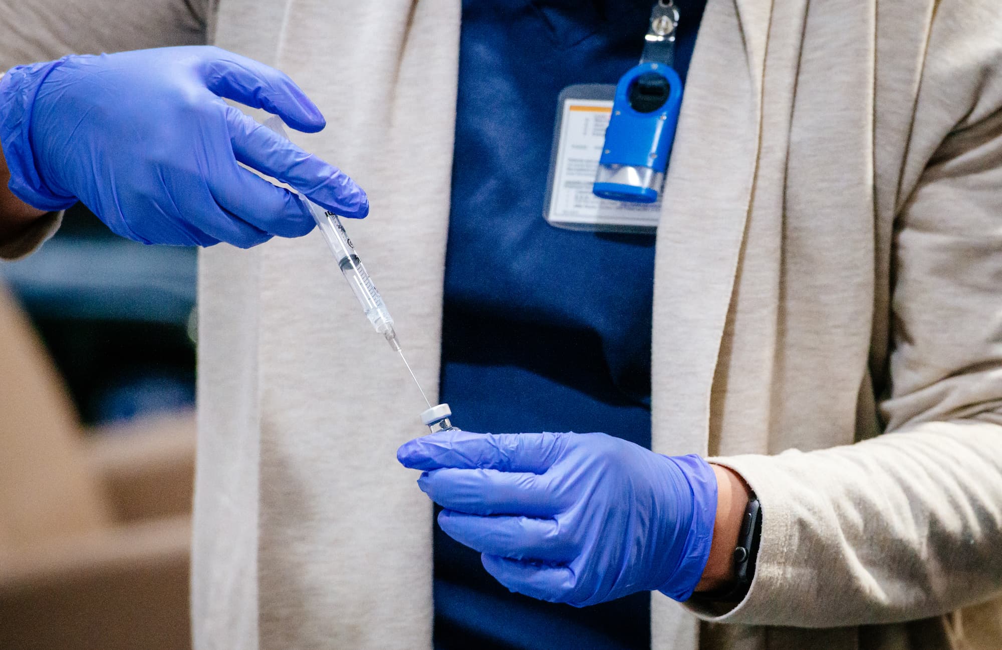 A provider prepares to deliver the COVID-19 vaccine to a recipient. (VIA UAB)
