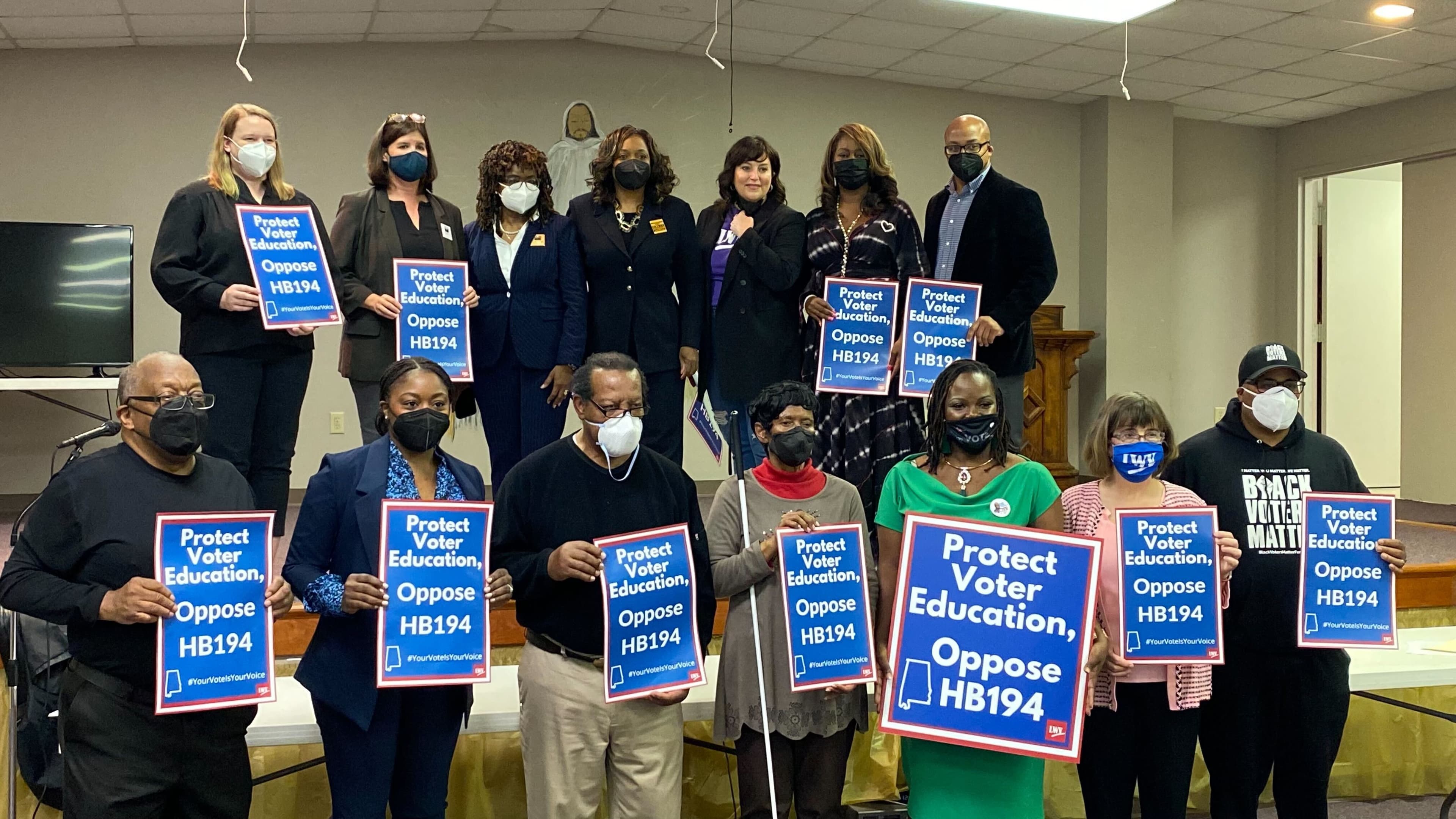 Voting Rights activists gather for a picture at St. John's A.M.E. Church in Montgomery, speaking out against HB194. The bill would ban the acceptance of private donations, of both money and services, by public election officials. (Jacob Holmes / APR)
