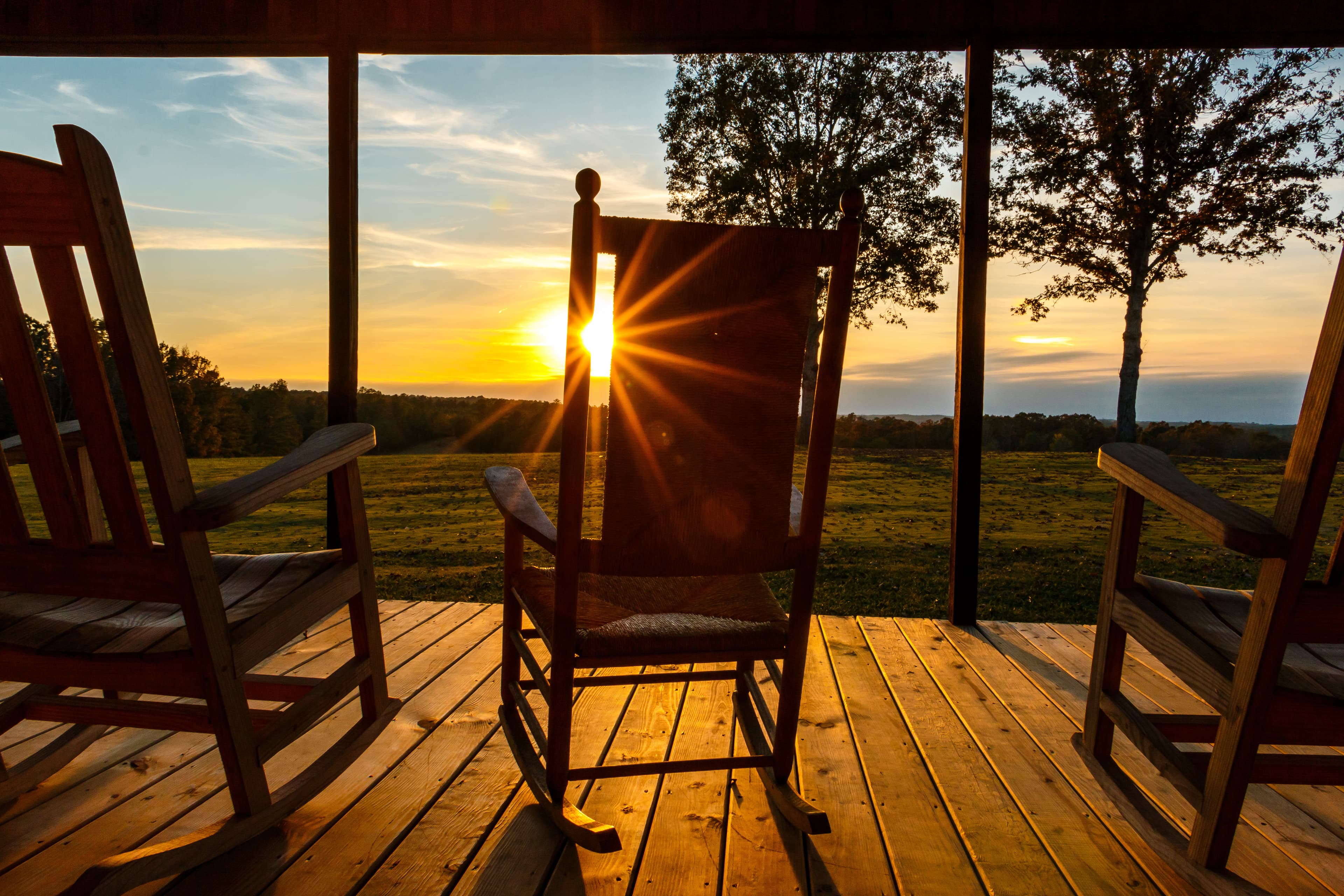 sun burst through rocking chair on front porch