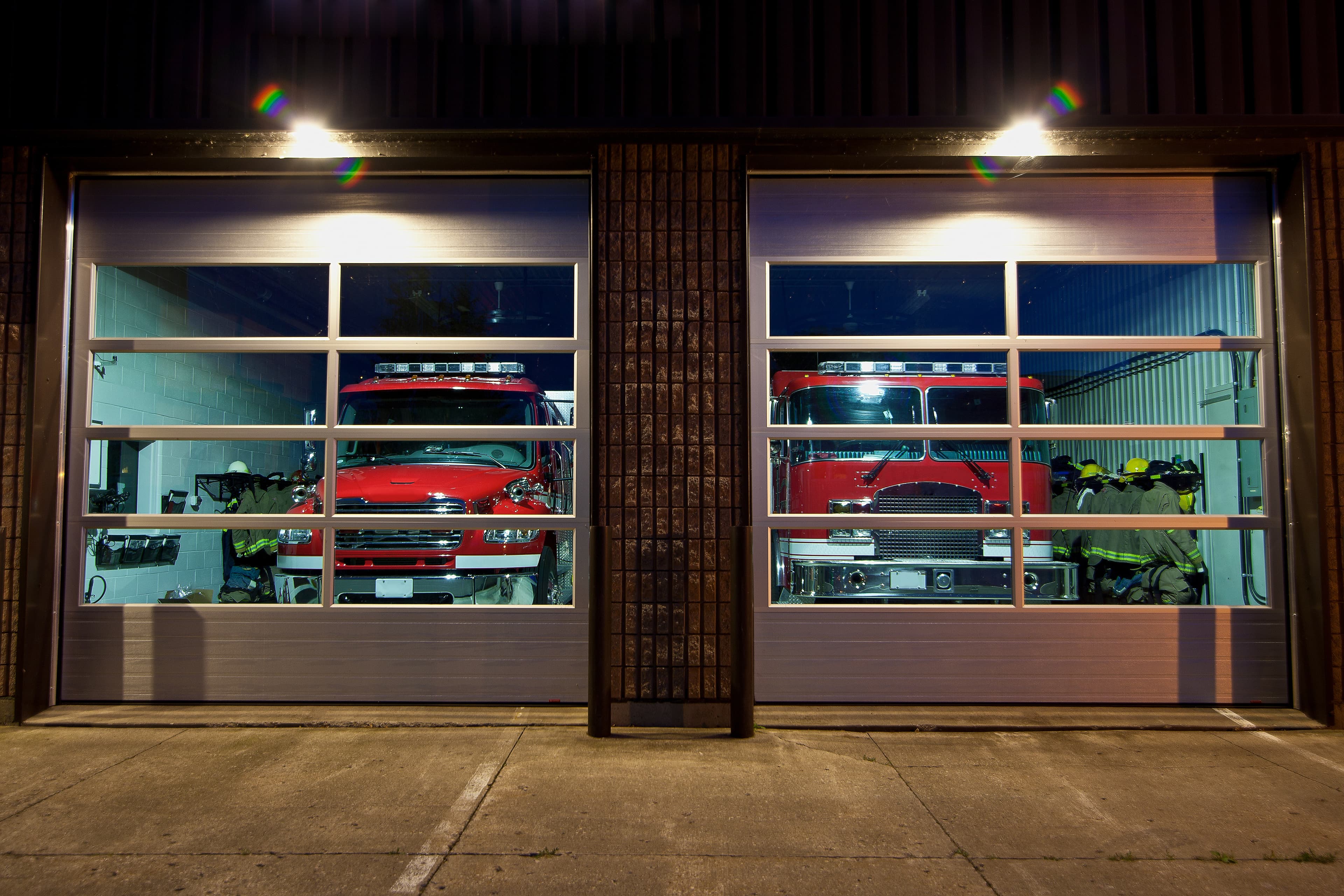 The front of a fire station in the evening.