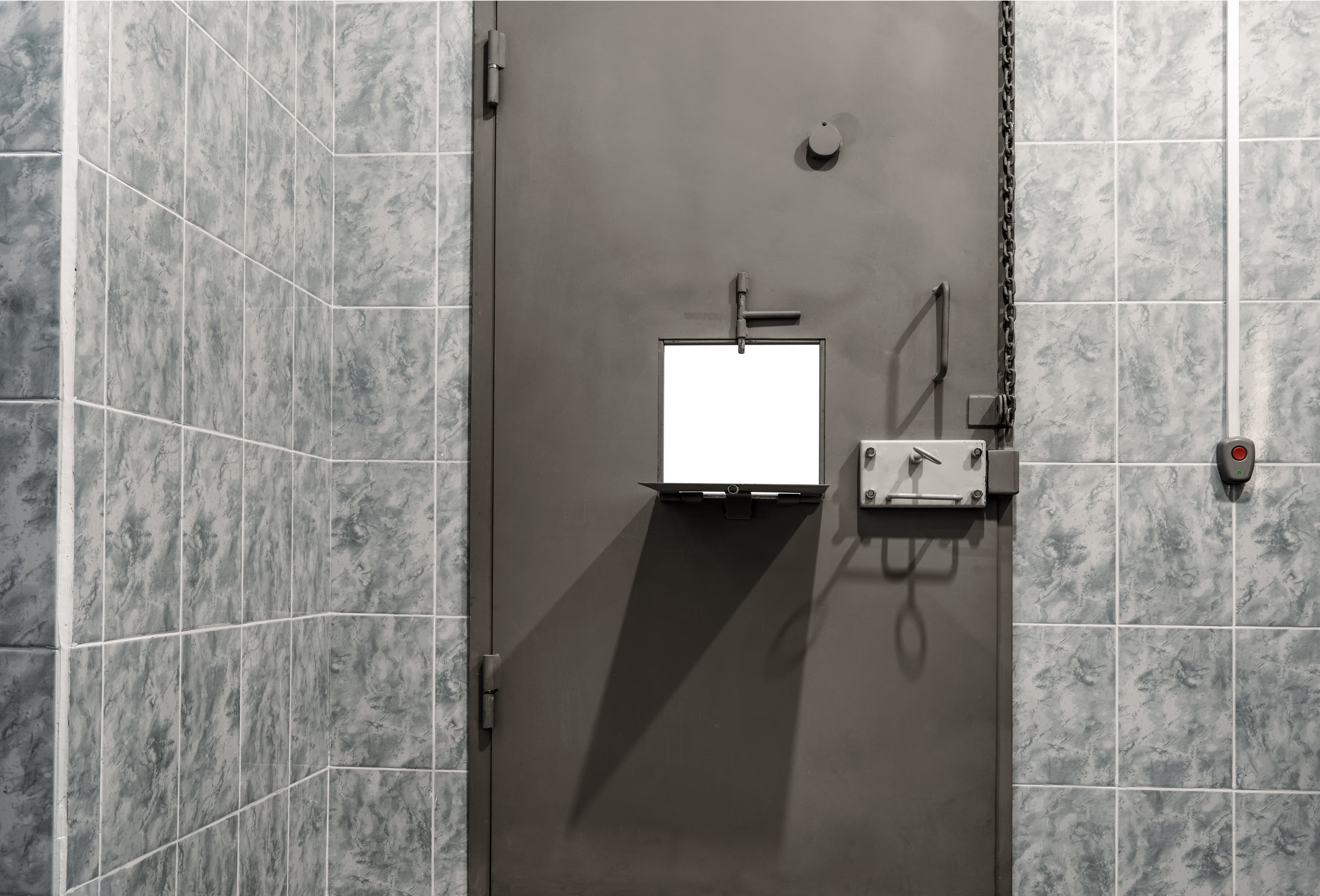 Detention cell with a metal door, temporary detention