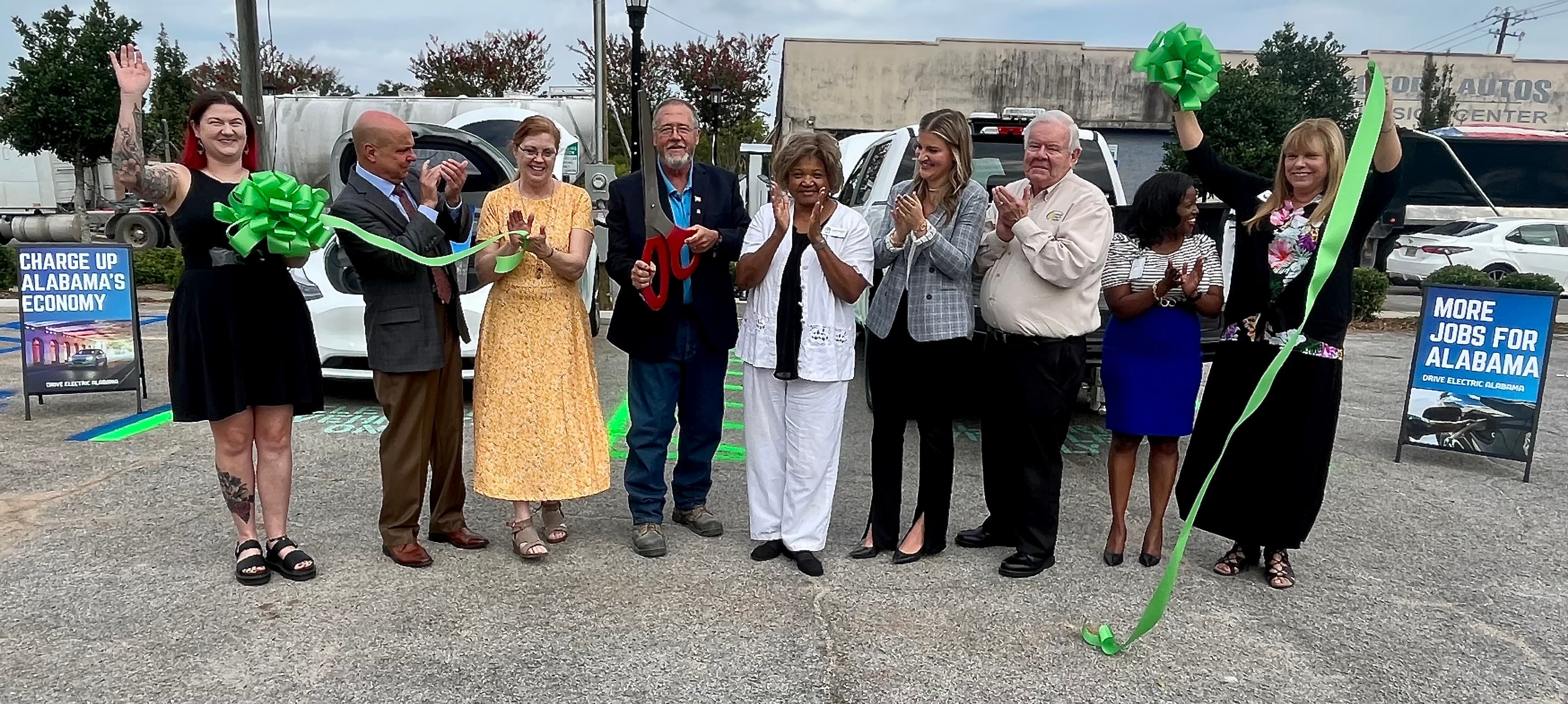 Montevallo Mayor Rusty Nix cuts the ribbon for the new electric vehicle charging station located downtown, across the street from City Hall, on Thursday, Sept. 14, 2023.