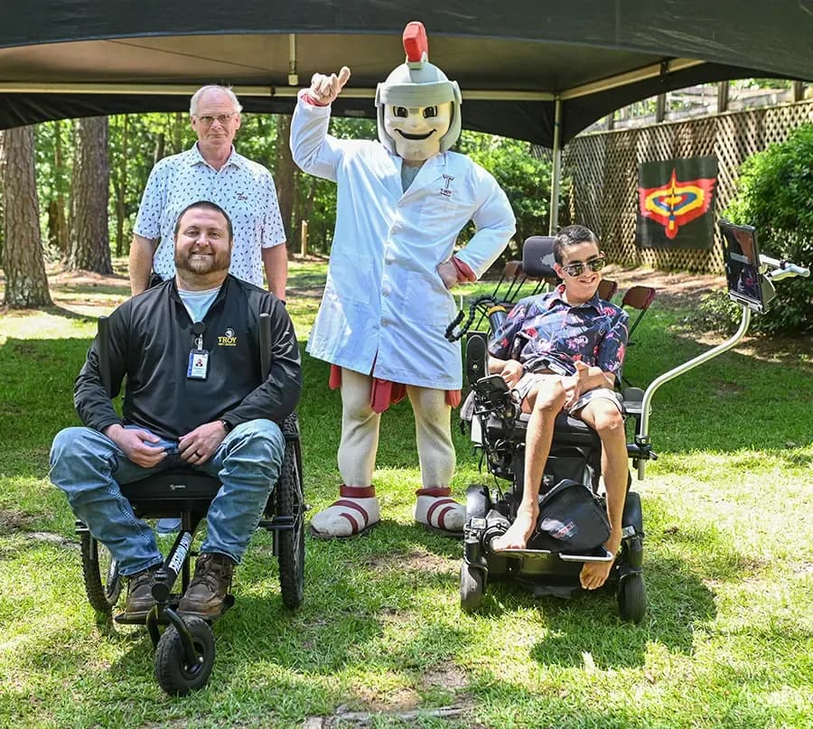 Back row, L-R: Dr. Alvin Diamond and T-ROY. Front row, L-R: Jonah McWaters and Hank Poore.