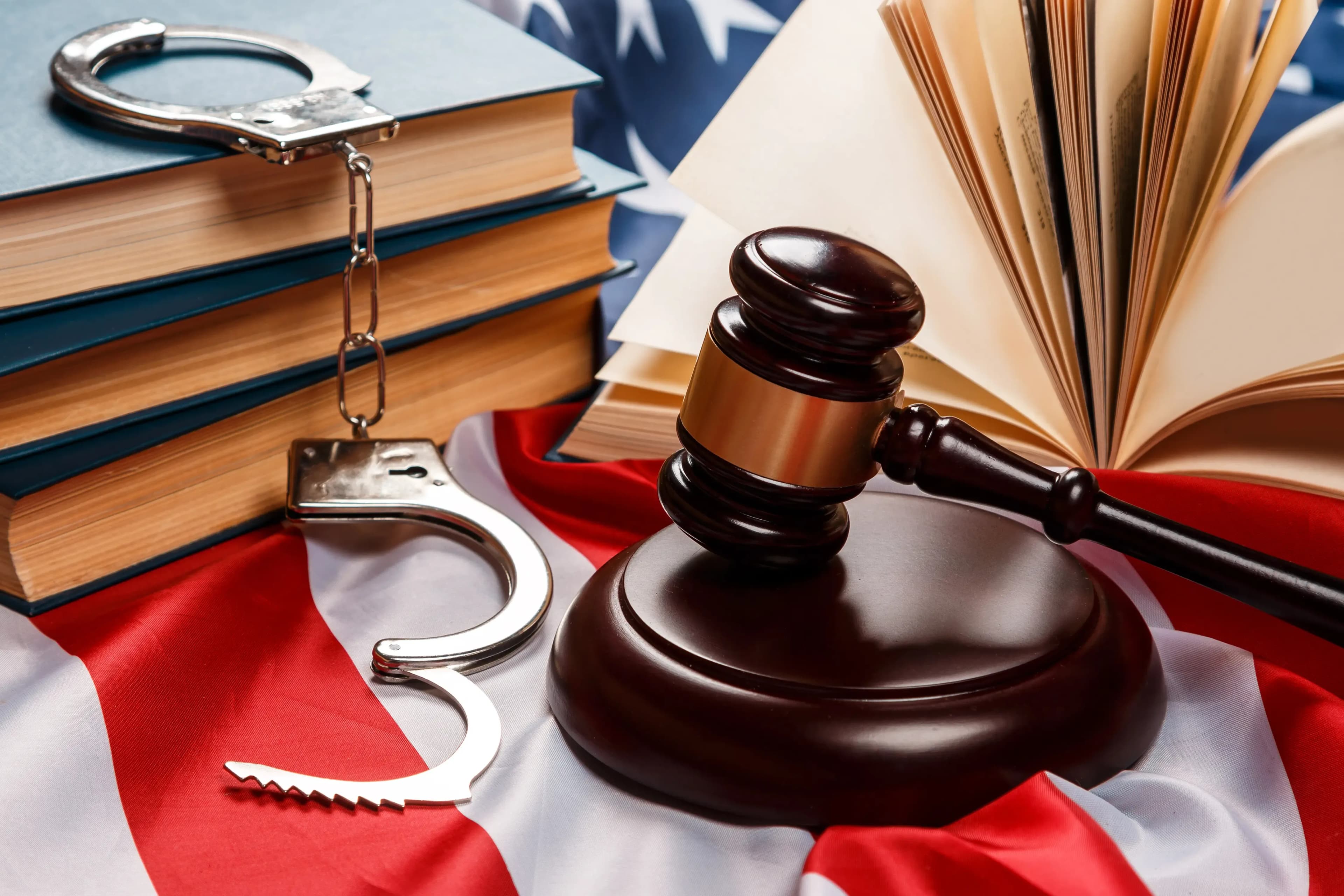 Gavel, books and handcuffs