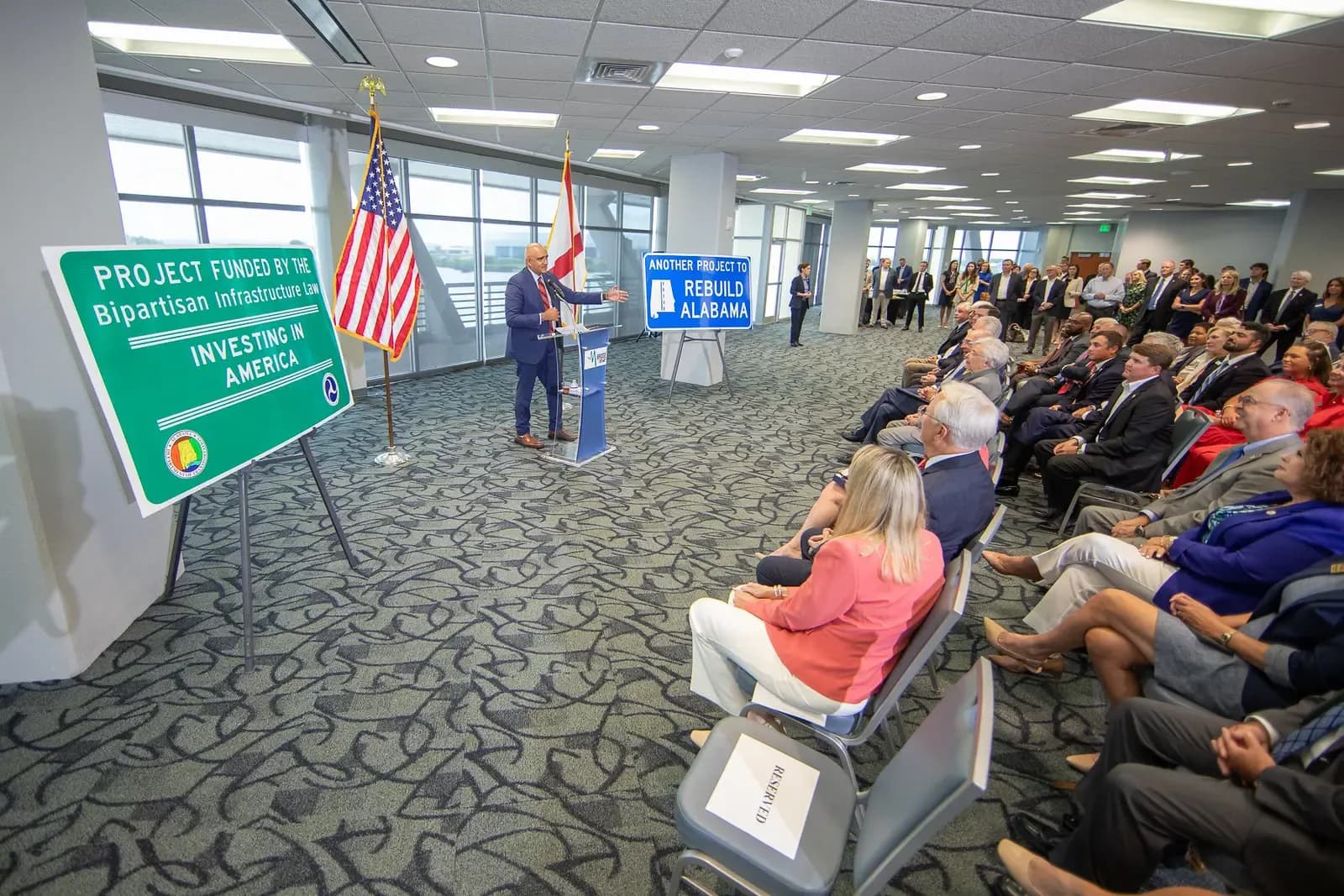 Dignitaries deliver remarks during the I-10 Mobile River Bridge and Bayway Grant Event at the GulfQuest National Maritime Museum in Mobile, Alabama.