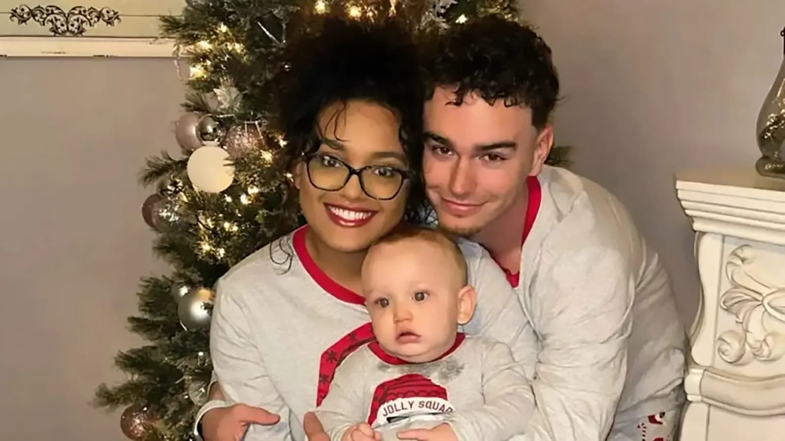 The Costas with their son, Xavier, at Christmas.