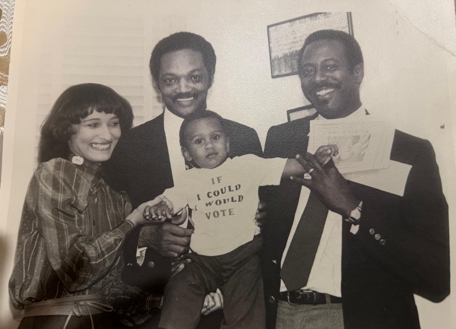 Rev. Jesse Jackson Sr., posing with Akil Figures, and parents, state Senator Vivian Davis Figures, and former state Senator Michael Figures.