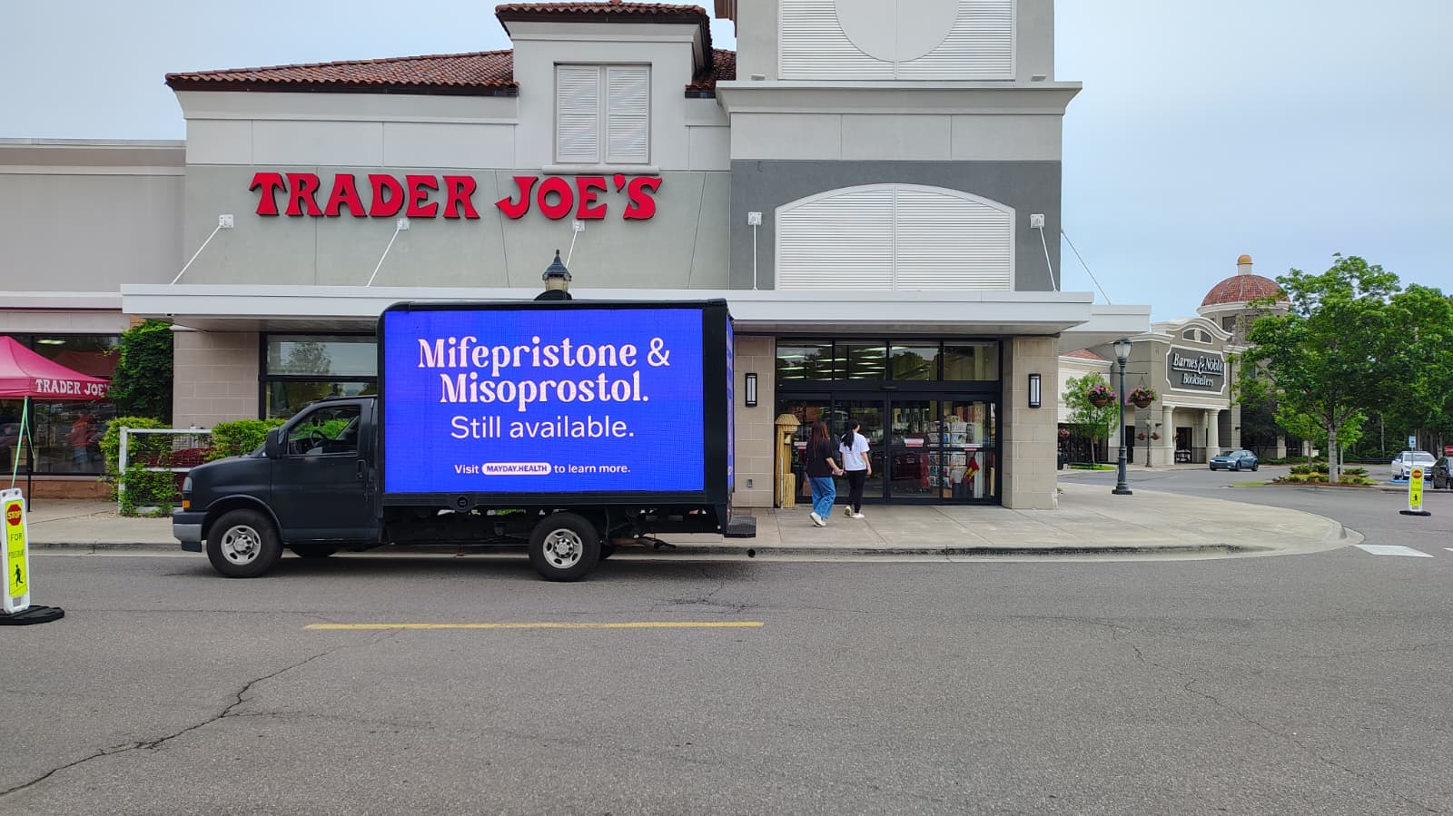 Billboard truck carries sign reading "Mifepristone & Misoprostol. Still available," in Birmingham, Alabama.