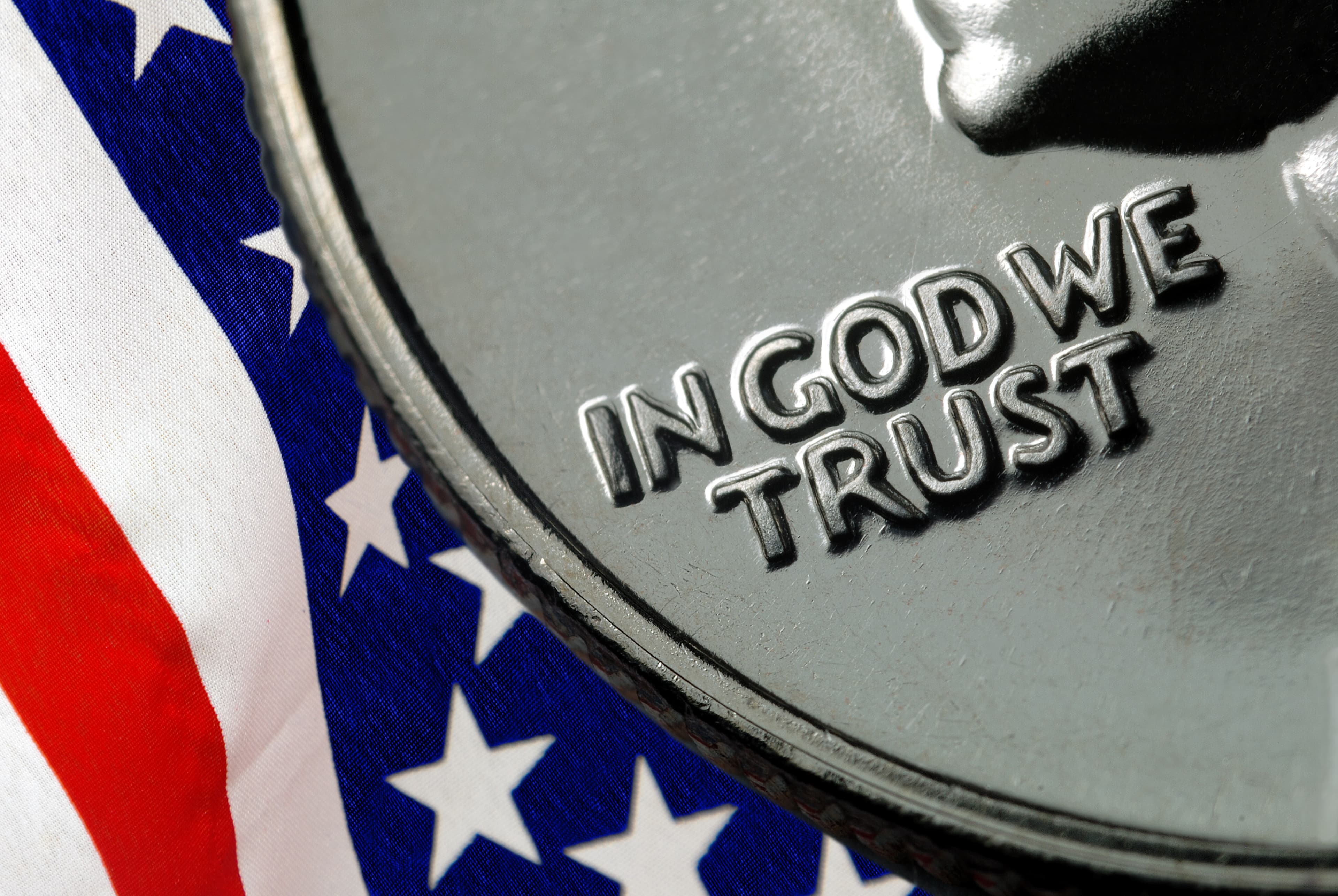In God We Trust on 1967 United States Quarter over American Flag