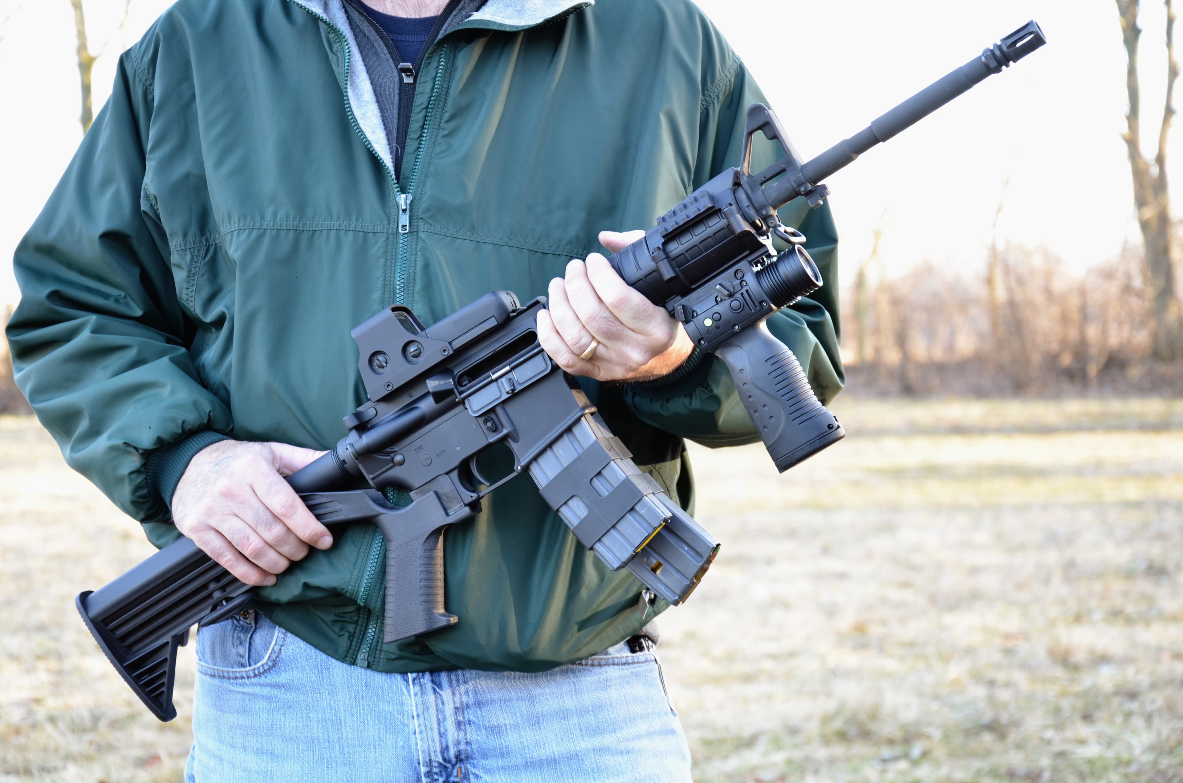 AR-15, M-4 style rifle being held.