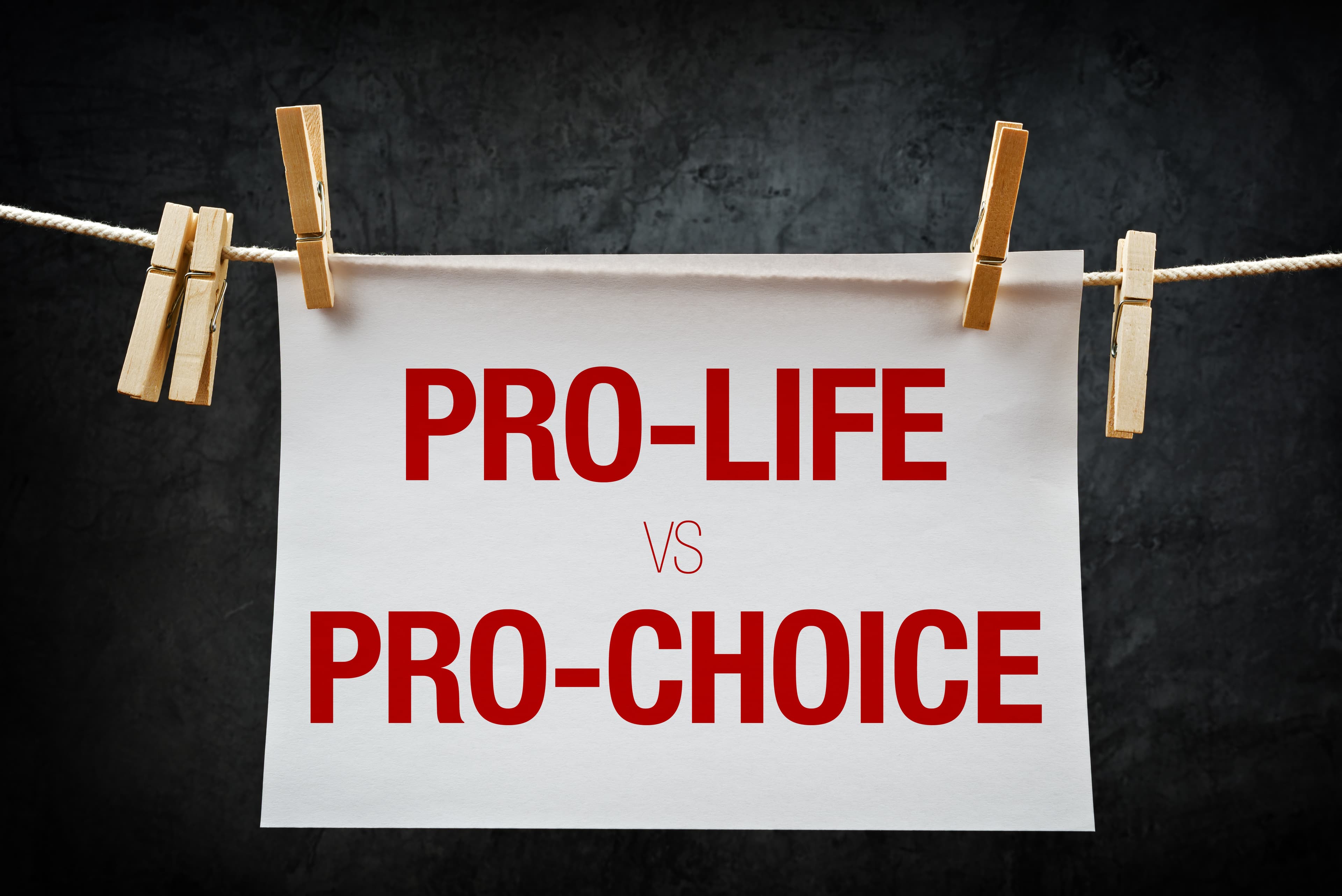 Pro-life vs pro-choice, female right on abortion concept