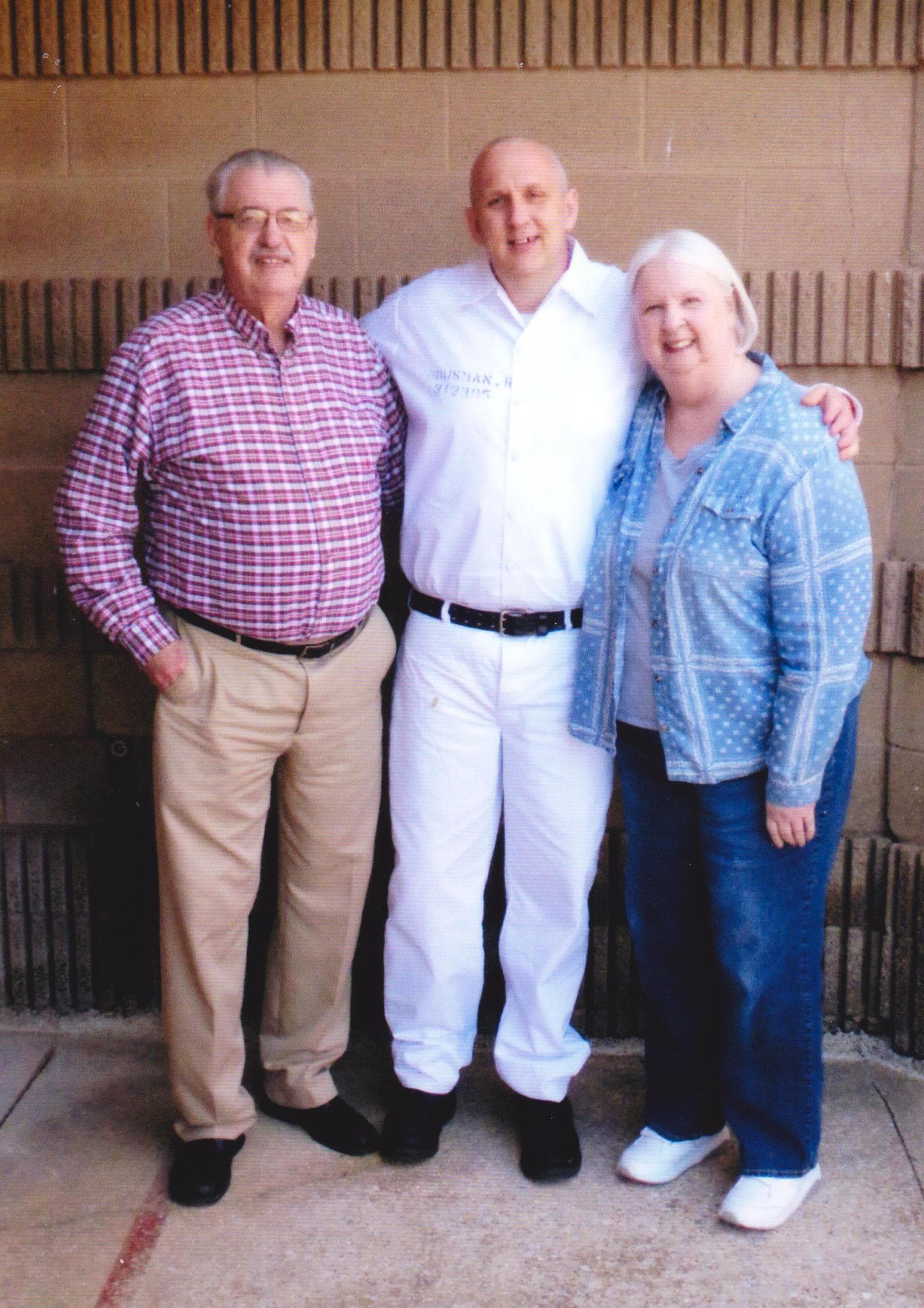 Russell Housman with his mother, Sara Dodson and stepfather, Danny Dodson.
