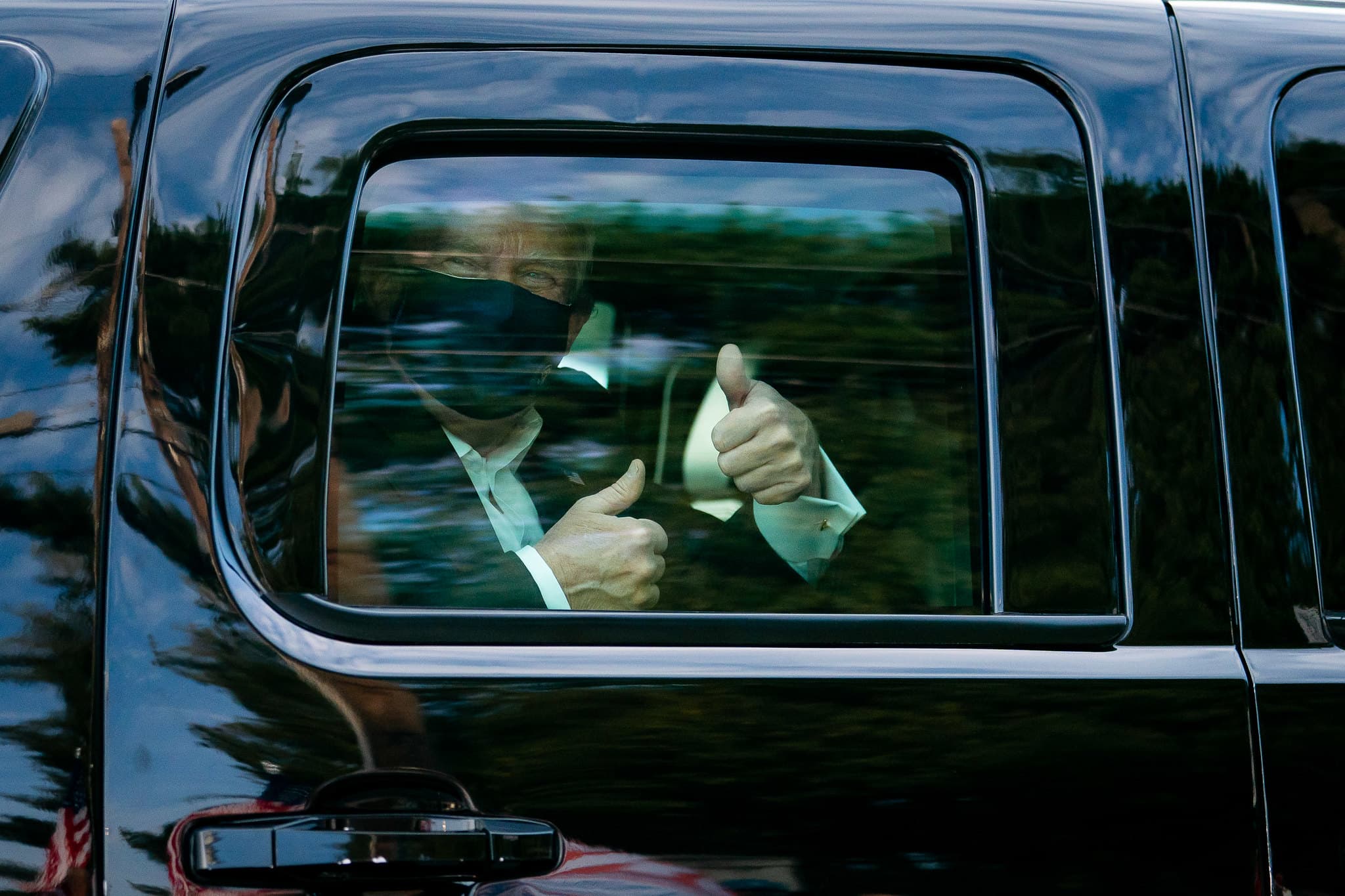 President Donald J. Trump greets supporters during a drive by outside of Walter Reed National Military Medical Center Sunday, Oct. 4, 2020, in Bethesda, Md. (Official White House Photo by Tia Dufour)