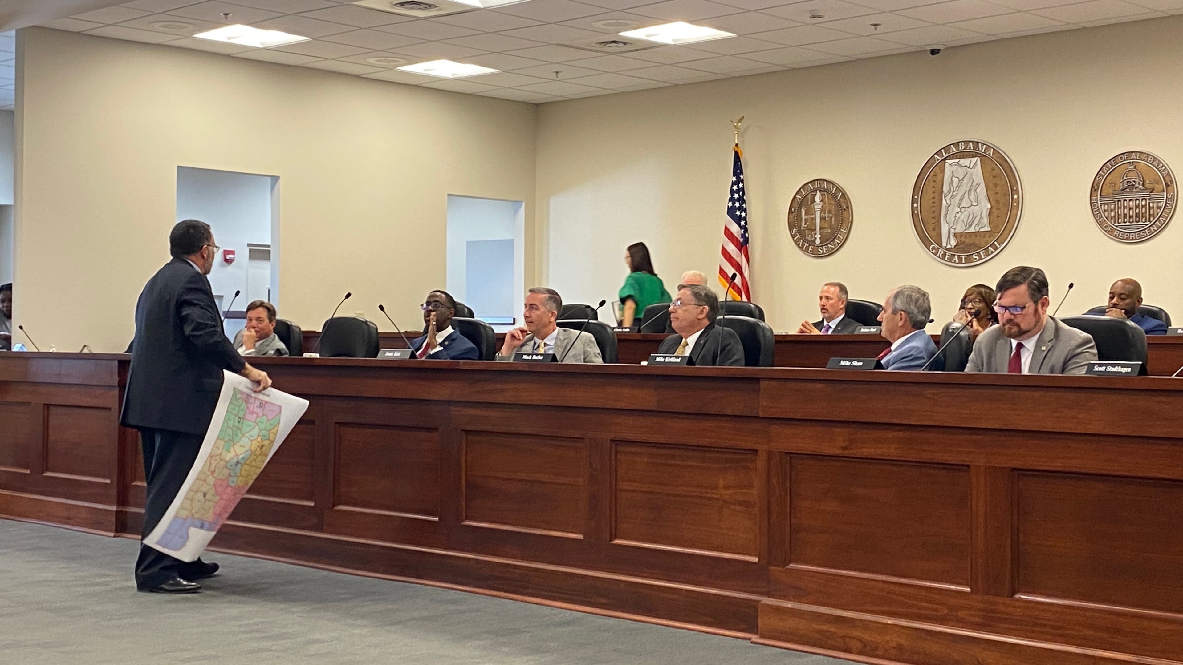 House Reapportionment Chair Chris Pringle, R-Mobile, holds up a map od his Congressional district plan before a House committee in 2023.