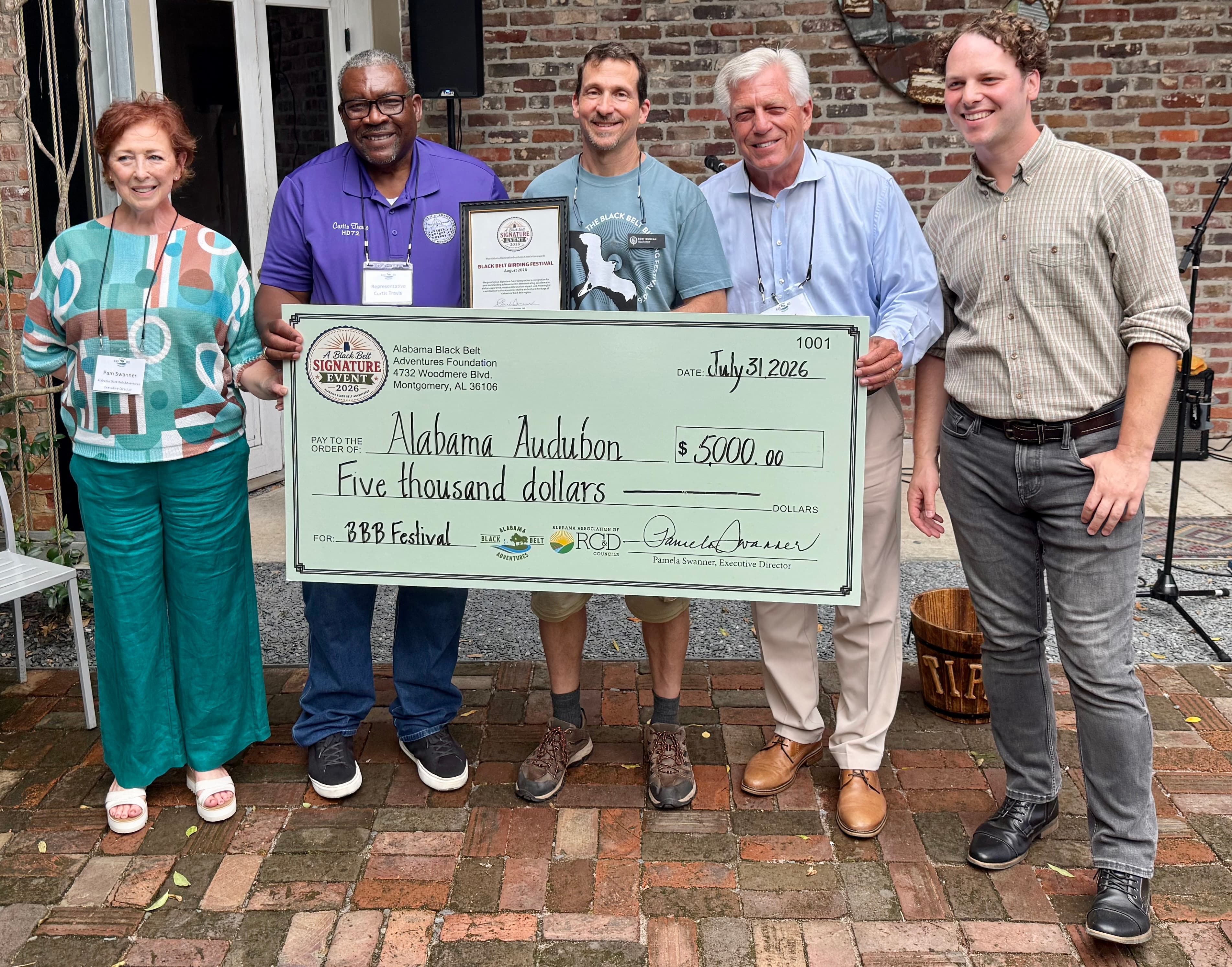 Alabama Black Belt Adventures Association Executive Director Pam Swanner presents the $5,000 grant check to Alabama Audubon to support the Alabama Black Belt Birding Festival's continued growth and future programming. Pictured, from left, are Swanner, State Rep. Curtis Travis, Alabama Audubon executive director Dr. R. Scot Duncan, State Sen. Gerald Allen and Tim Higgins, coordinator of the Black Belt Birding Festival.