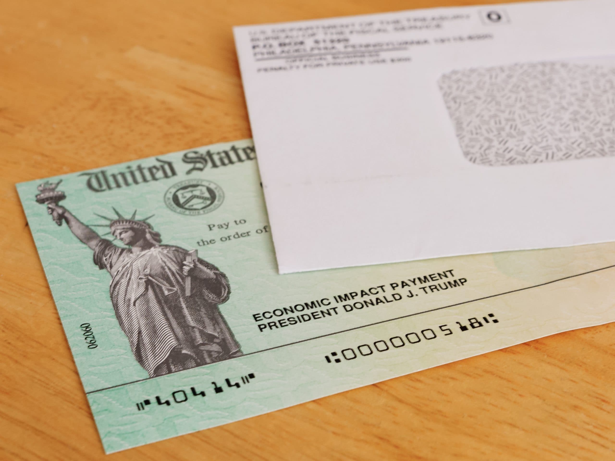 ATLANTA, GEORGIA - May 7, 2020 : United States Treasury Economic Impact check including President Donald J. Trump printed name. Stimulus check for Coronavirus COVID-19 pandemic relief.