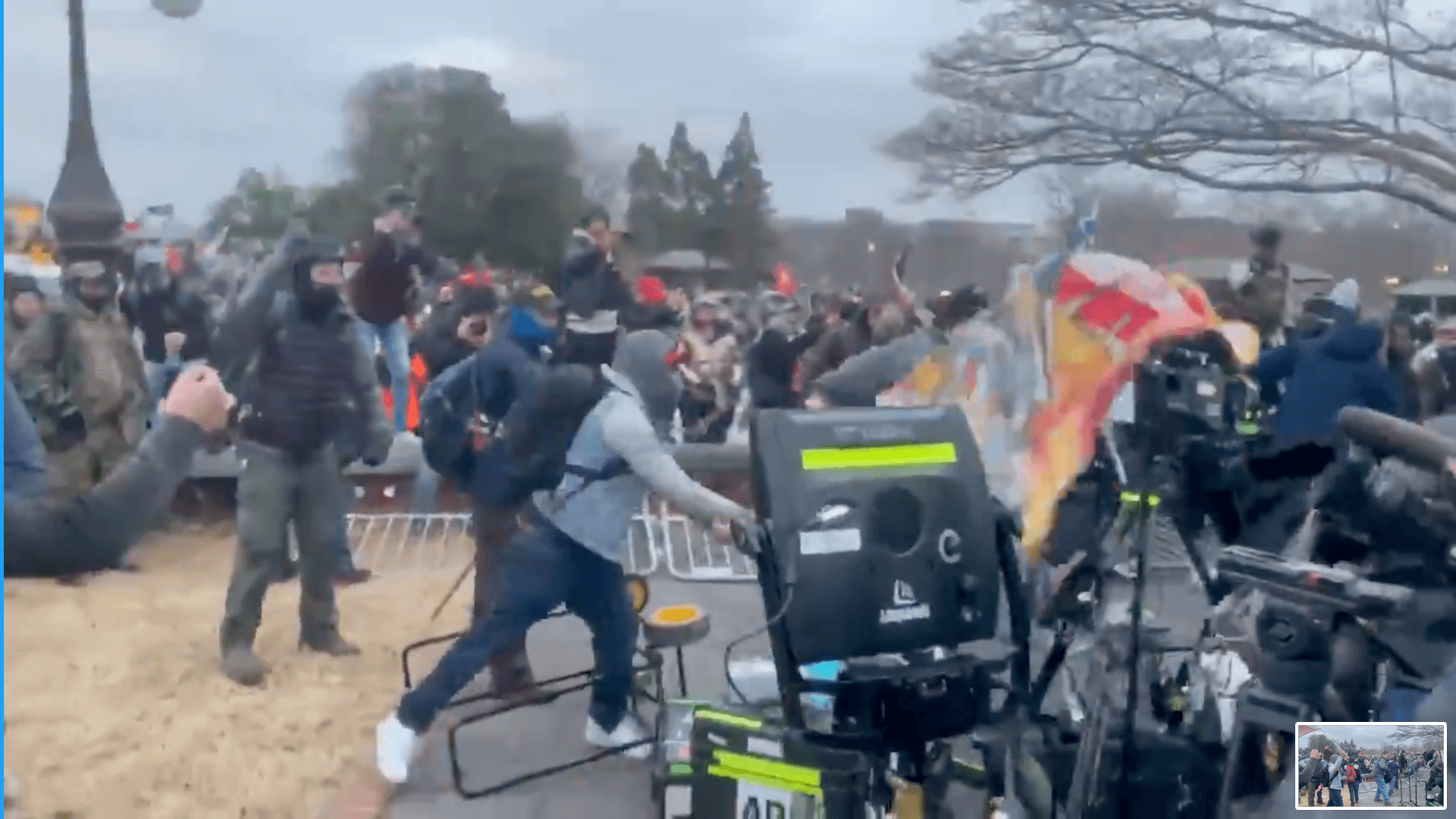 Supporters of President Donald Trump attack news media equipment at the U.S. Capitol on Wednesday, Jan. 6, 2021, in Washington. (VIA TWITTER)