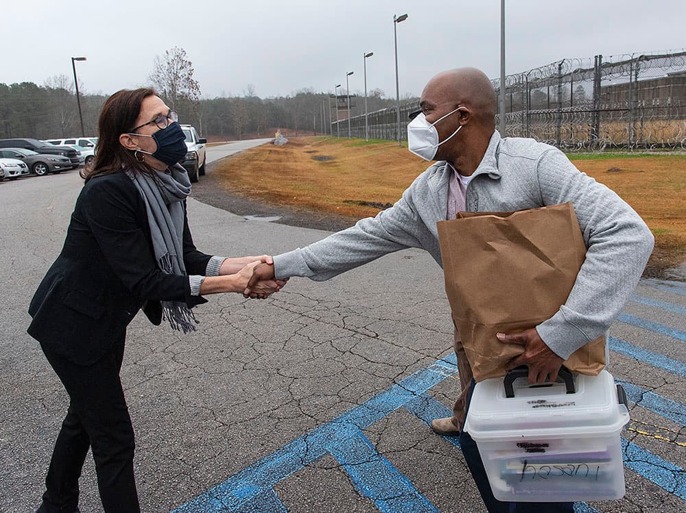 Alabama Appleseed's Carla Crowder with Ronald McKeithen the day of his release.
