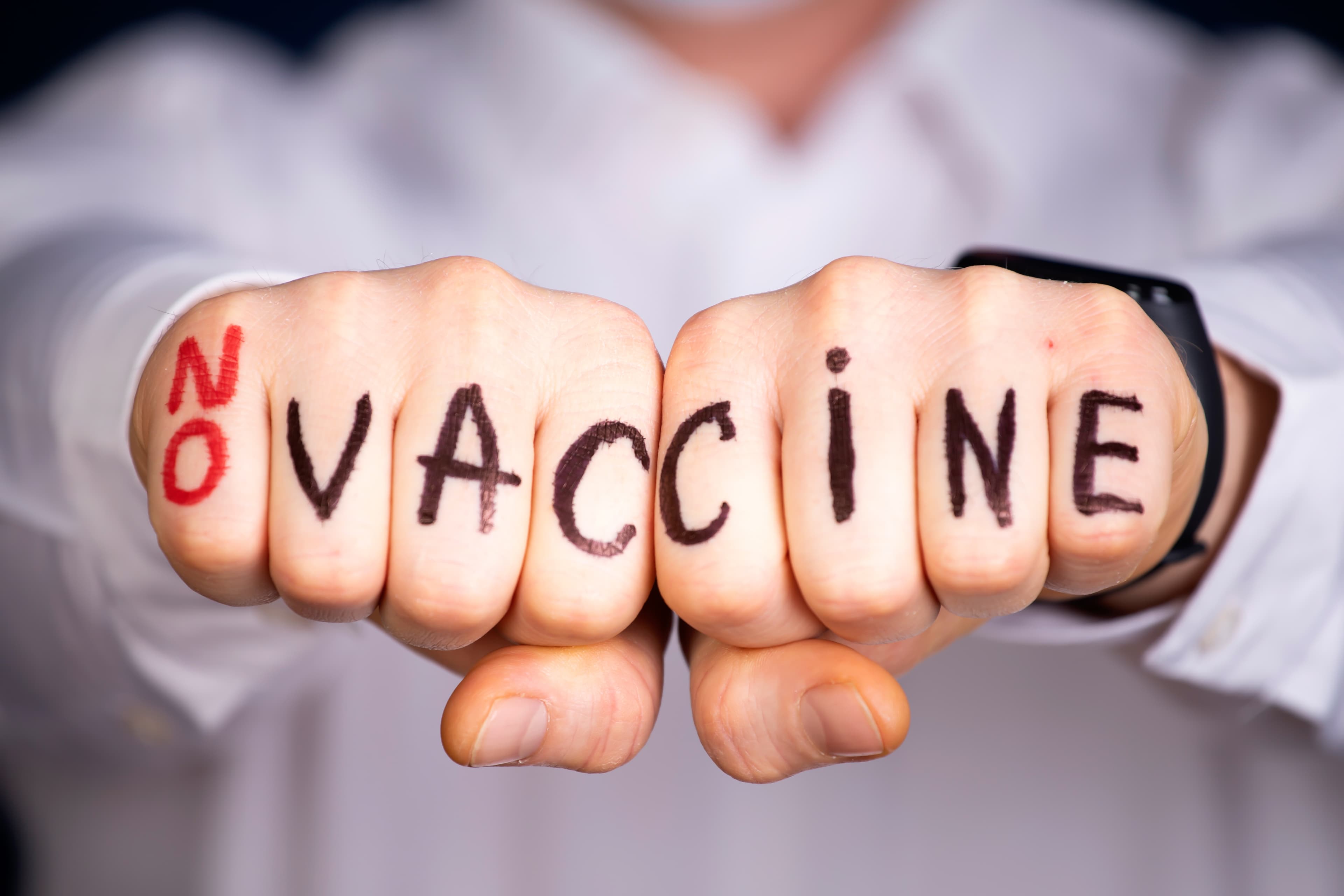 A anti vax or anti vaccine protests against the new covid-19 vaccine