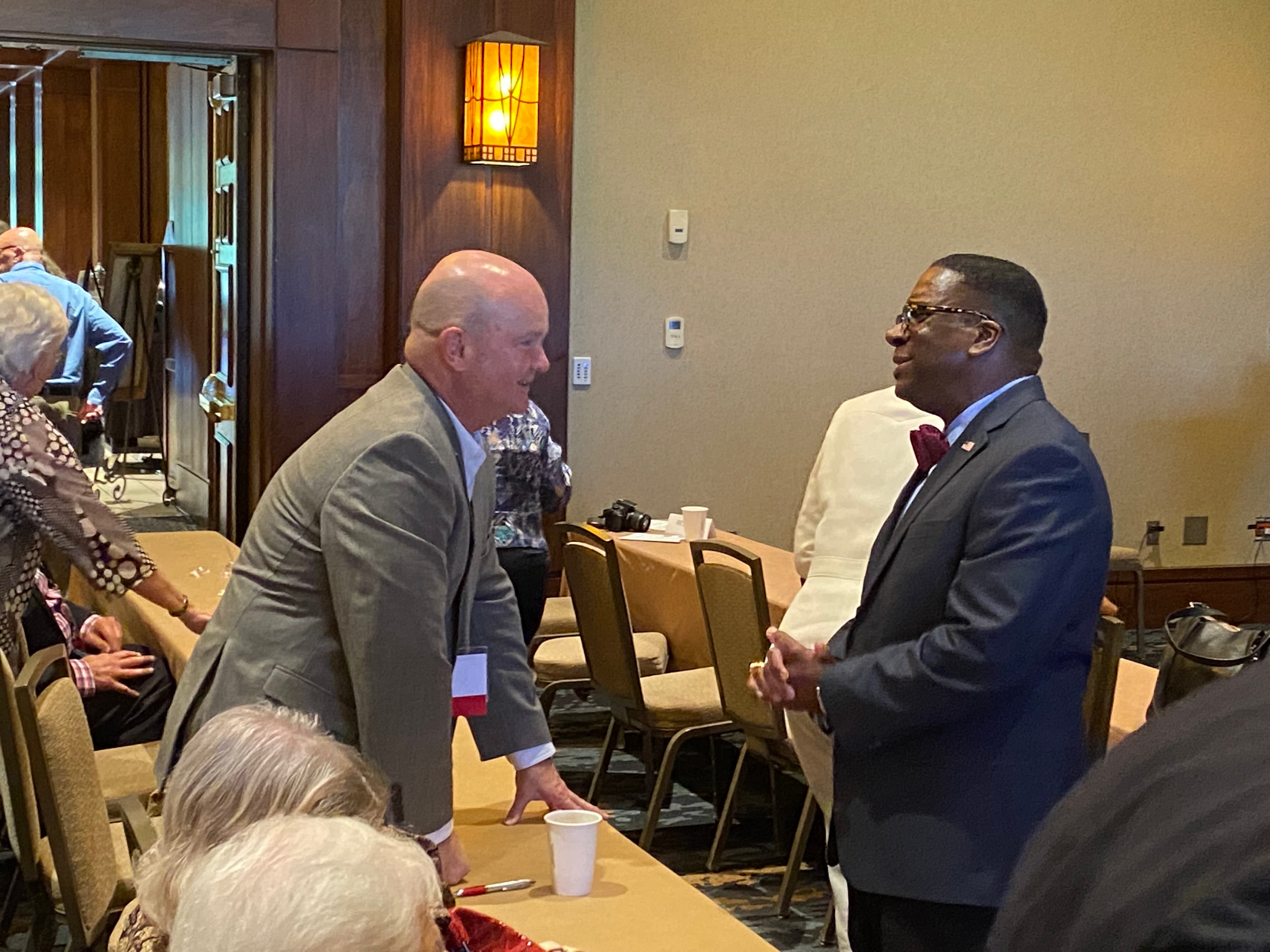 Dr. Will Boyd, Democratic nominee for U.S. Senate, speaks to a guest Wednesday at a candidate forum for Alabama public retirees. (Jacob Holmes/APR)