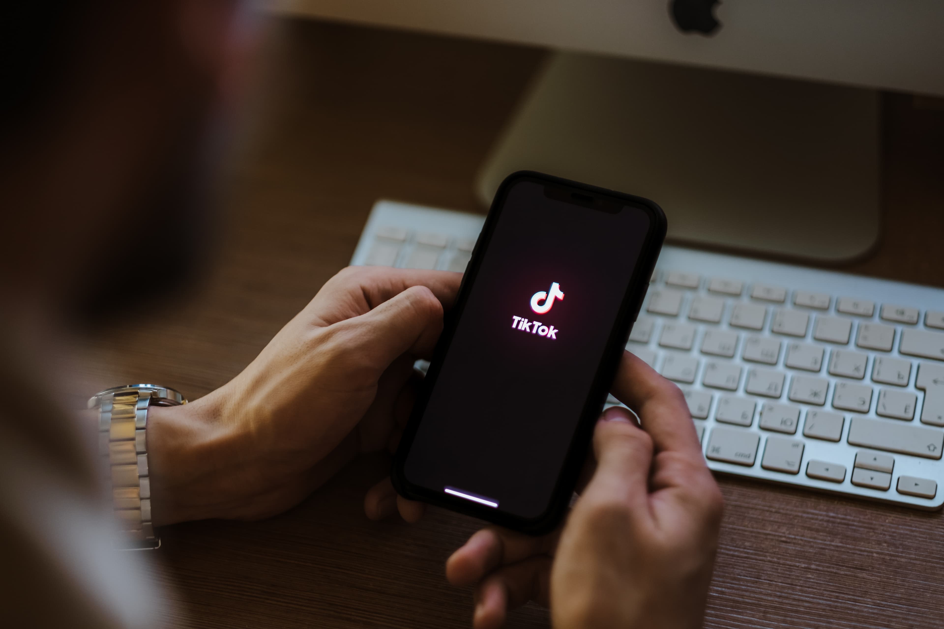 Man use TikTok app, tiktok logo on the screen. Rostov-on-Don, Ru