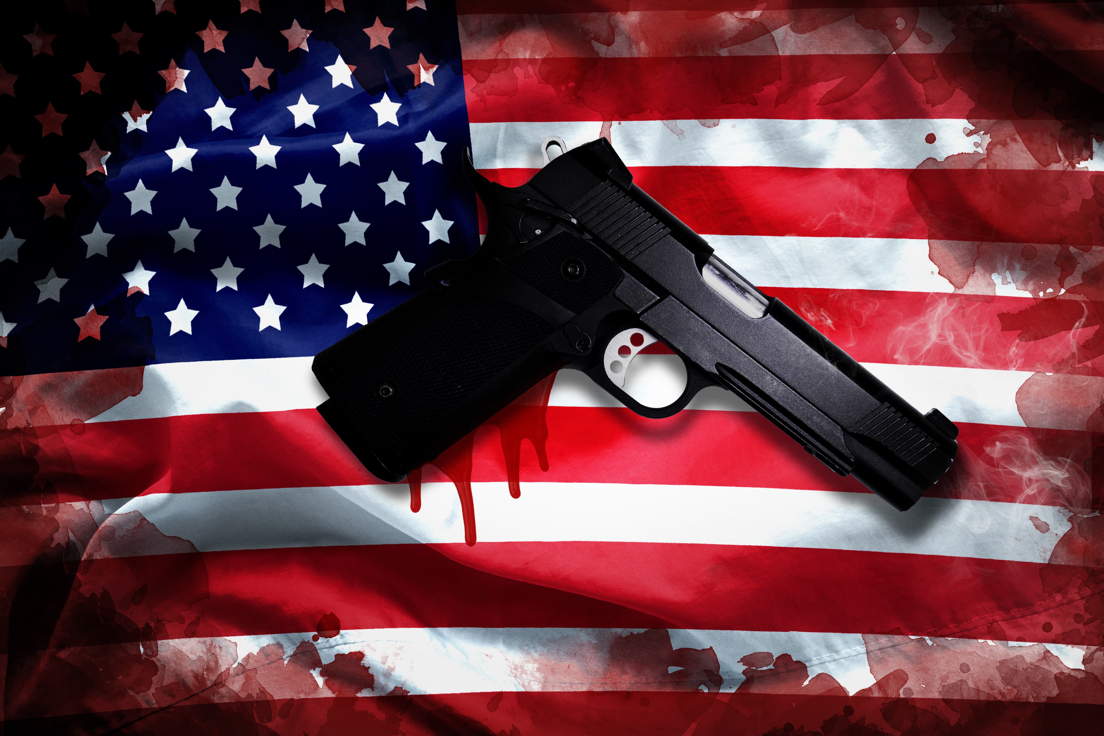handgun with blood stain on American flag. reform gun control in