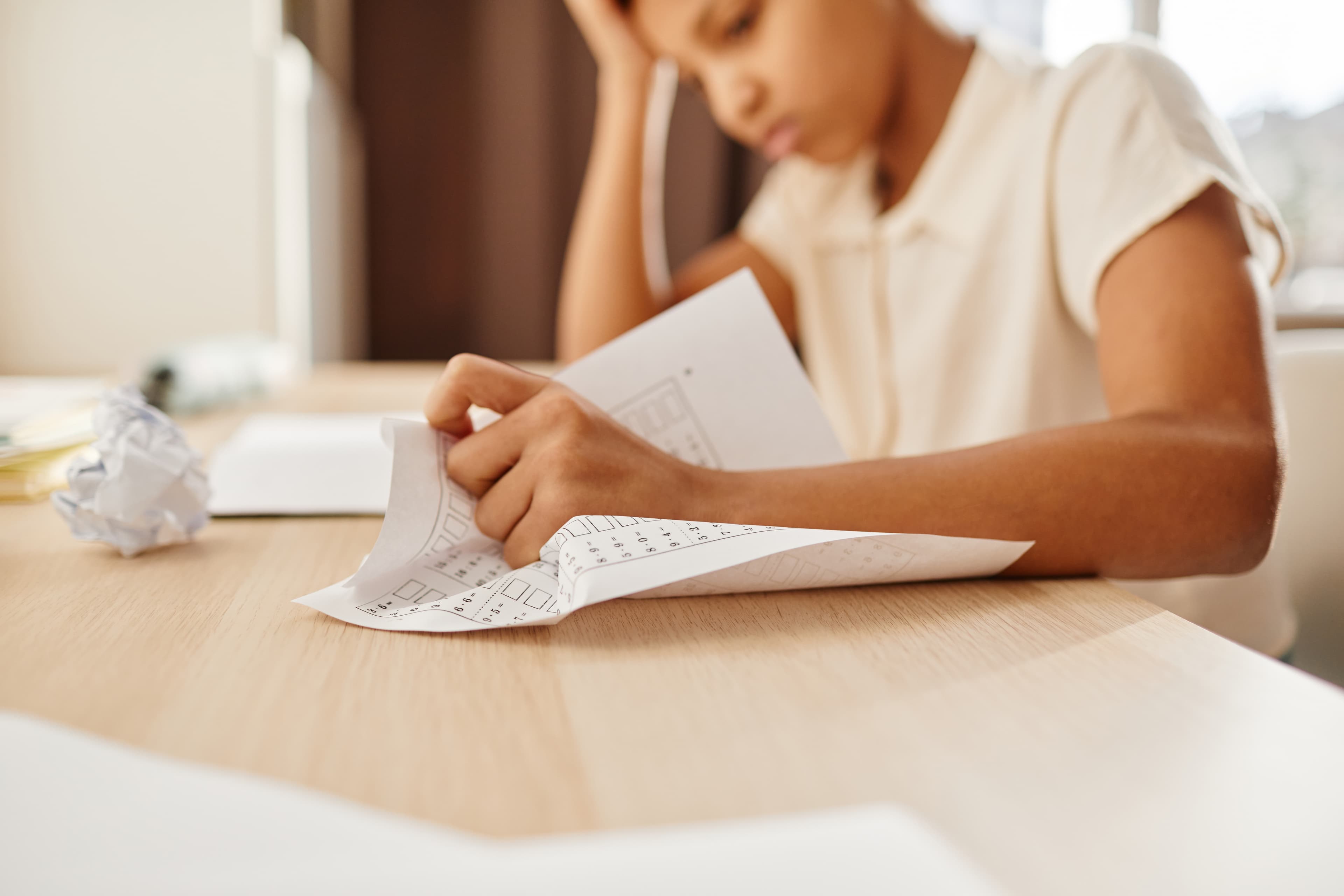 Stressed Child Crumpling Paper