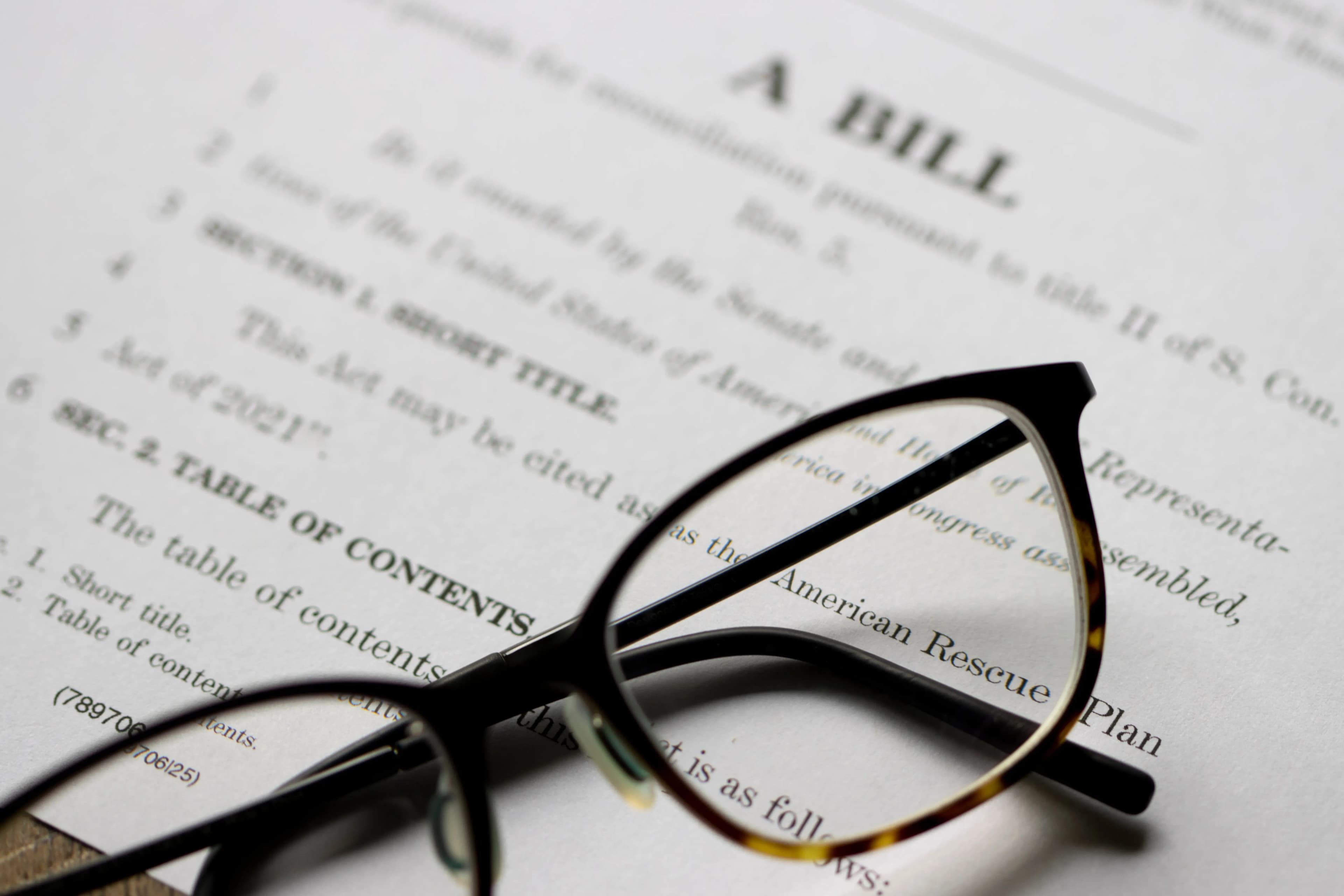 Closeup of the documents of the American Rescue Plan Act of 2021, an economic stimulus package proposed to speed up the recovery from the economic and