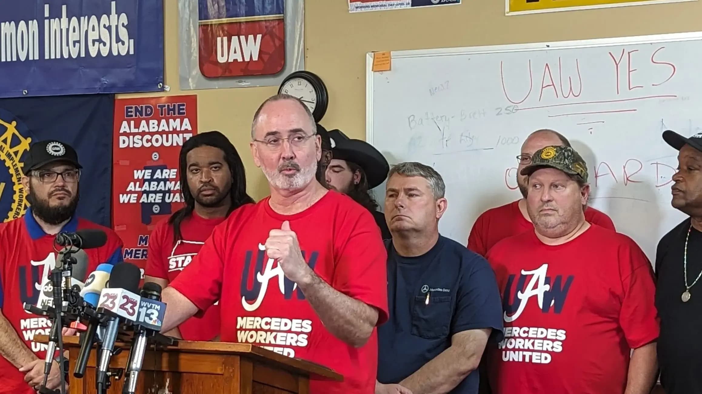 Surrounded by Mercedes workers, Shawn Fain discusses the election results at the UAW Local 112 headquarters.