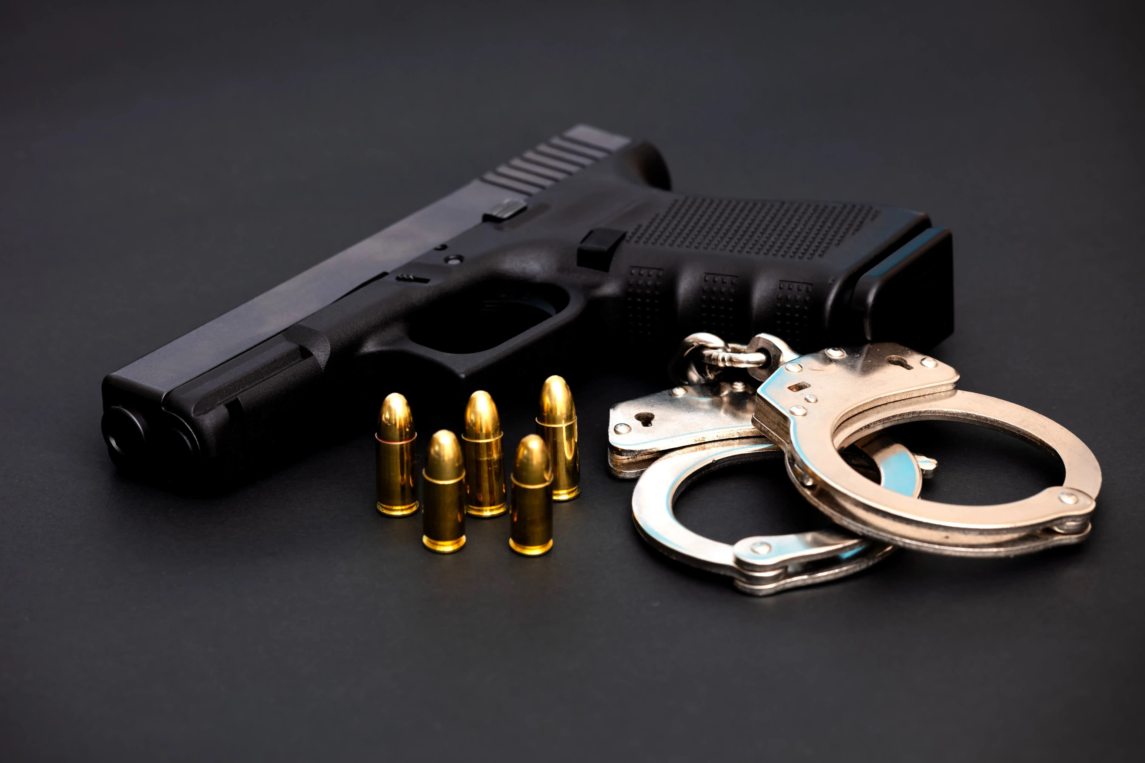 handgun with ammunition and handcuffs
