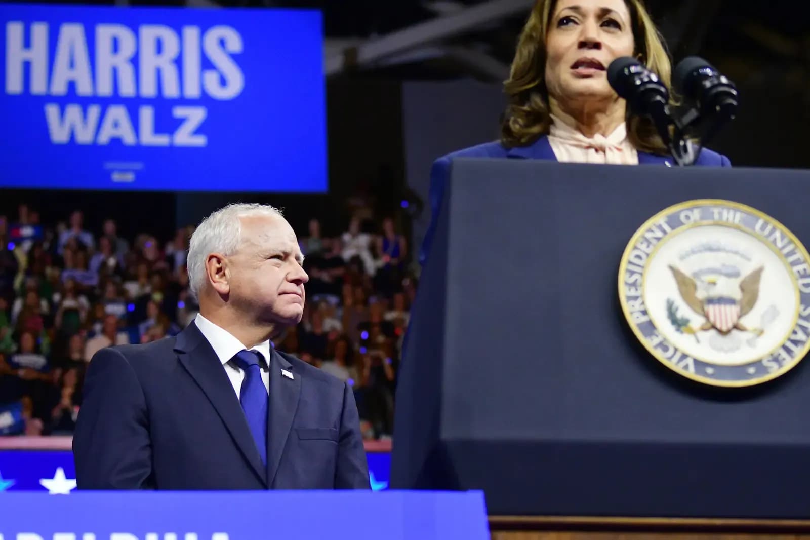 Gov. Tim Walz, of Minnesota is introduced on stage by U.S. Vice President Kamala Harris as her running mate during a rally in Philadelphia's Liacouras Center on August 6, 2024. The event marks the start of a battleground-state tour to present the Democratic ticket to voters.