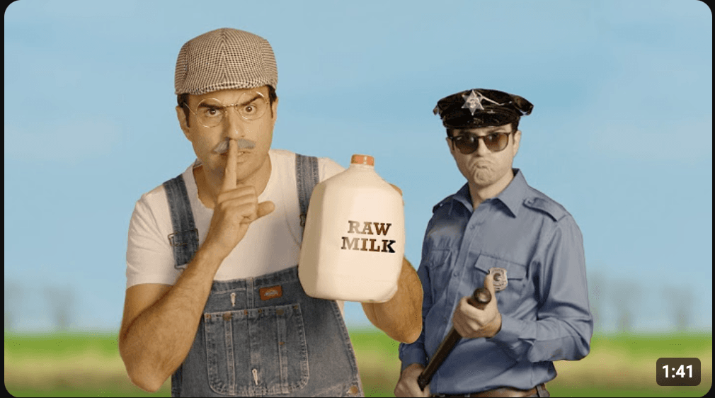 A thumbnail for a video produced by Reason Magazine draws a comparison between the raw milk trade and bootlegging by parodying the classic George Jones song "White Lightning." (REASON TV)