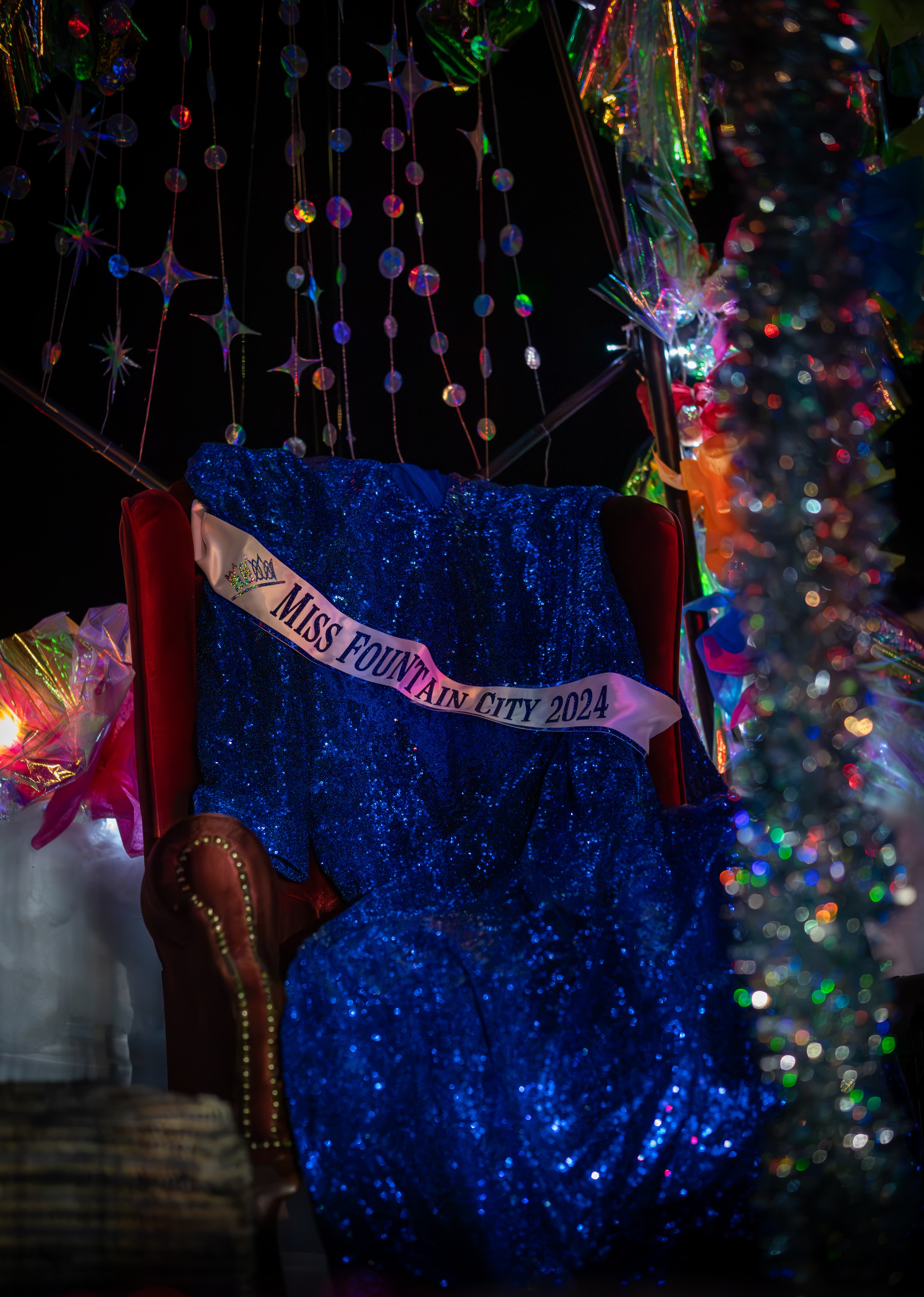 An evening gown is draped on an empty chair on the Prattville Pride float after Miss Fountain City Alee Michelle Sapphire decided not to join the float out of fear for their safety. (Wesleigh John/PRATTVILLE PRIDE)