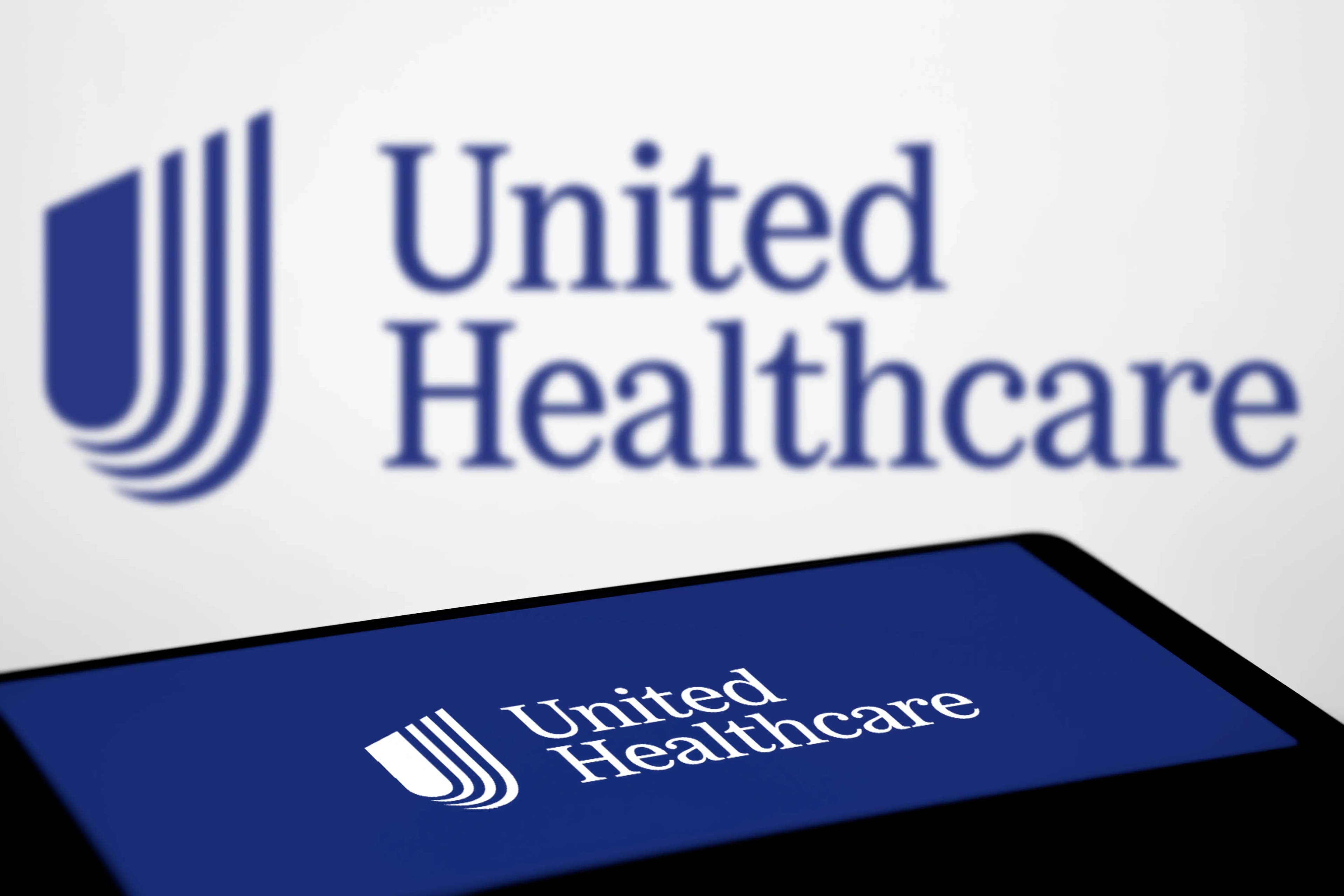 United Healthcare logo is displayed on smartphone.