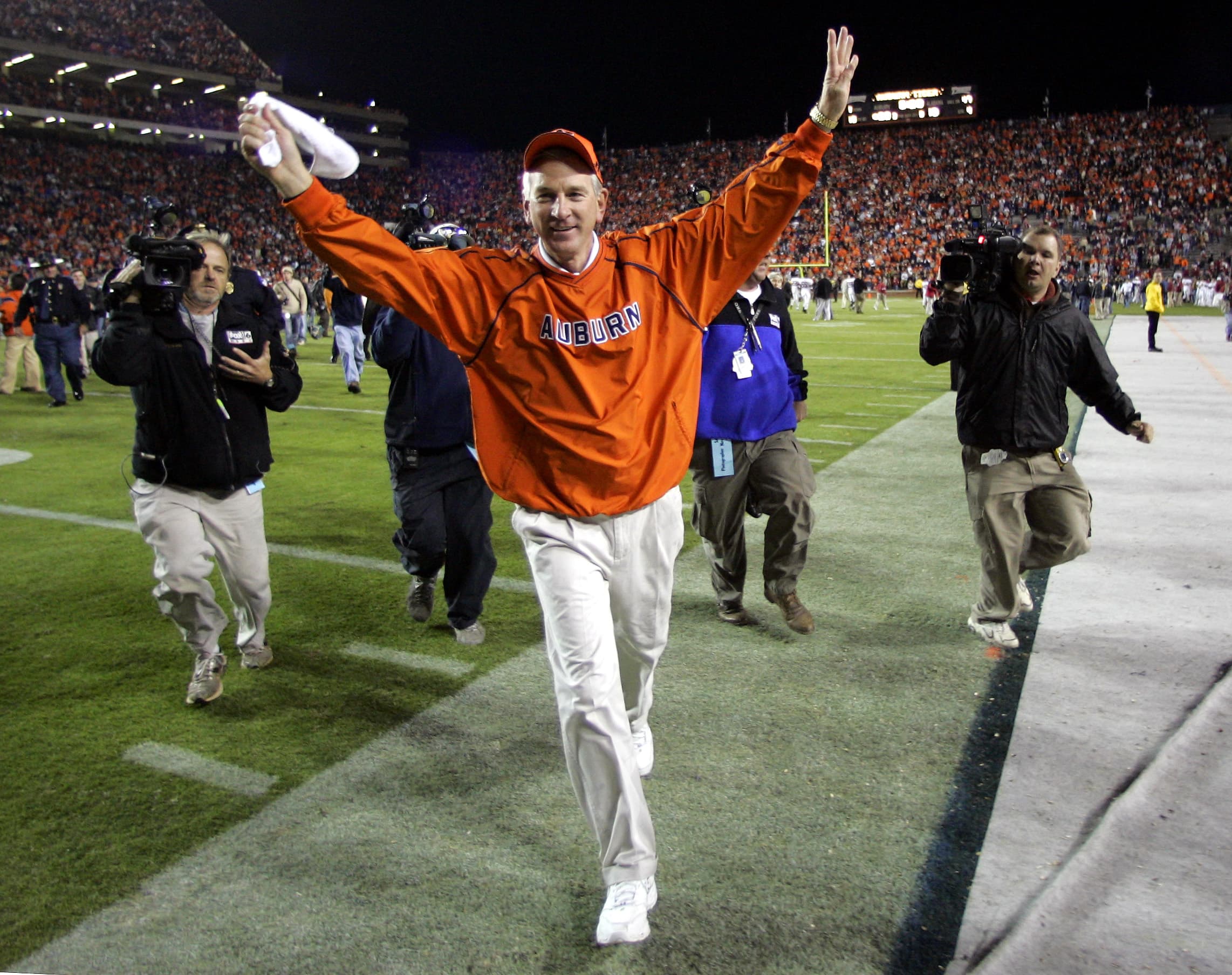 Auburn coach Tommy Tuberville celebrates the Tigers 28-18 win over Alabama in the Iron Bowl, Saturday Nov. 19, 2005 in Auburn, Ala.