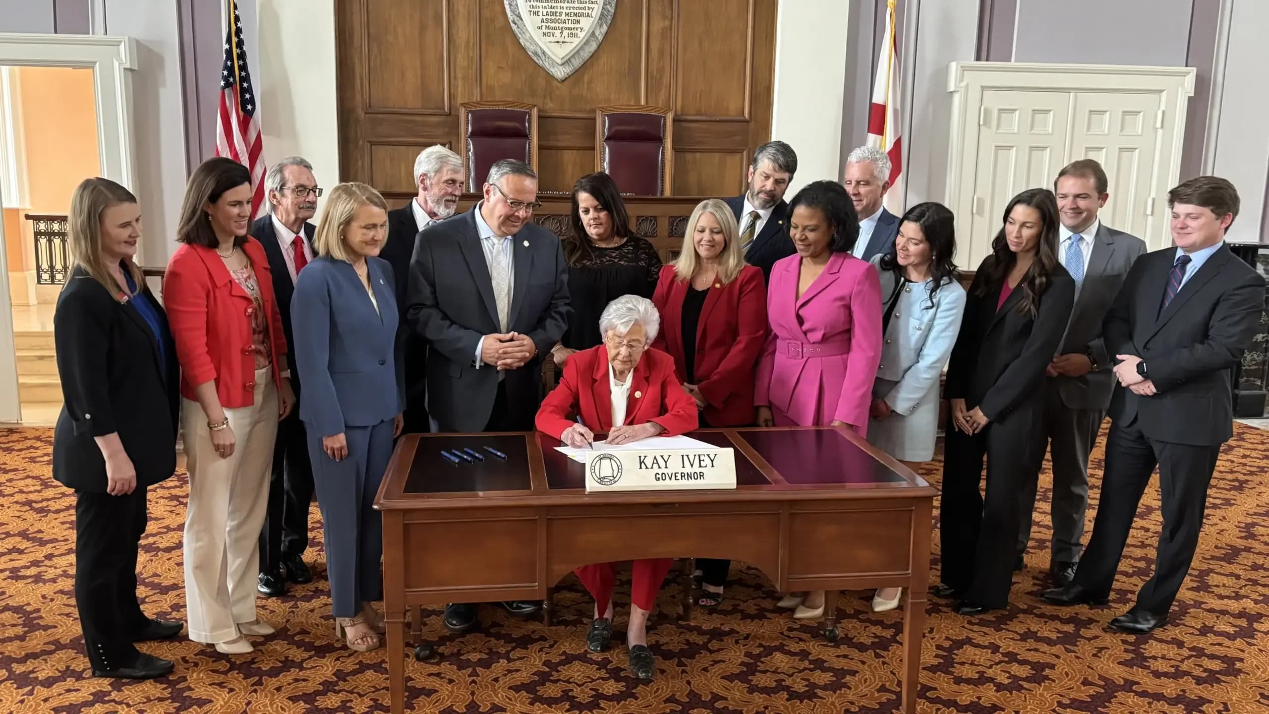 Gov. Kay Ivey sighs the Alabama Development Fund.
