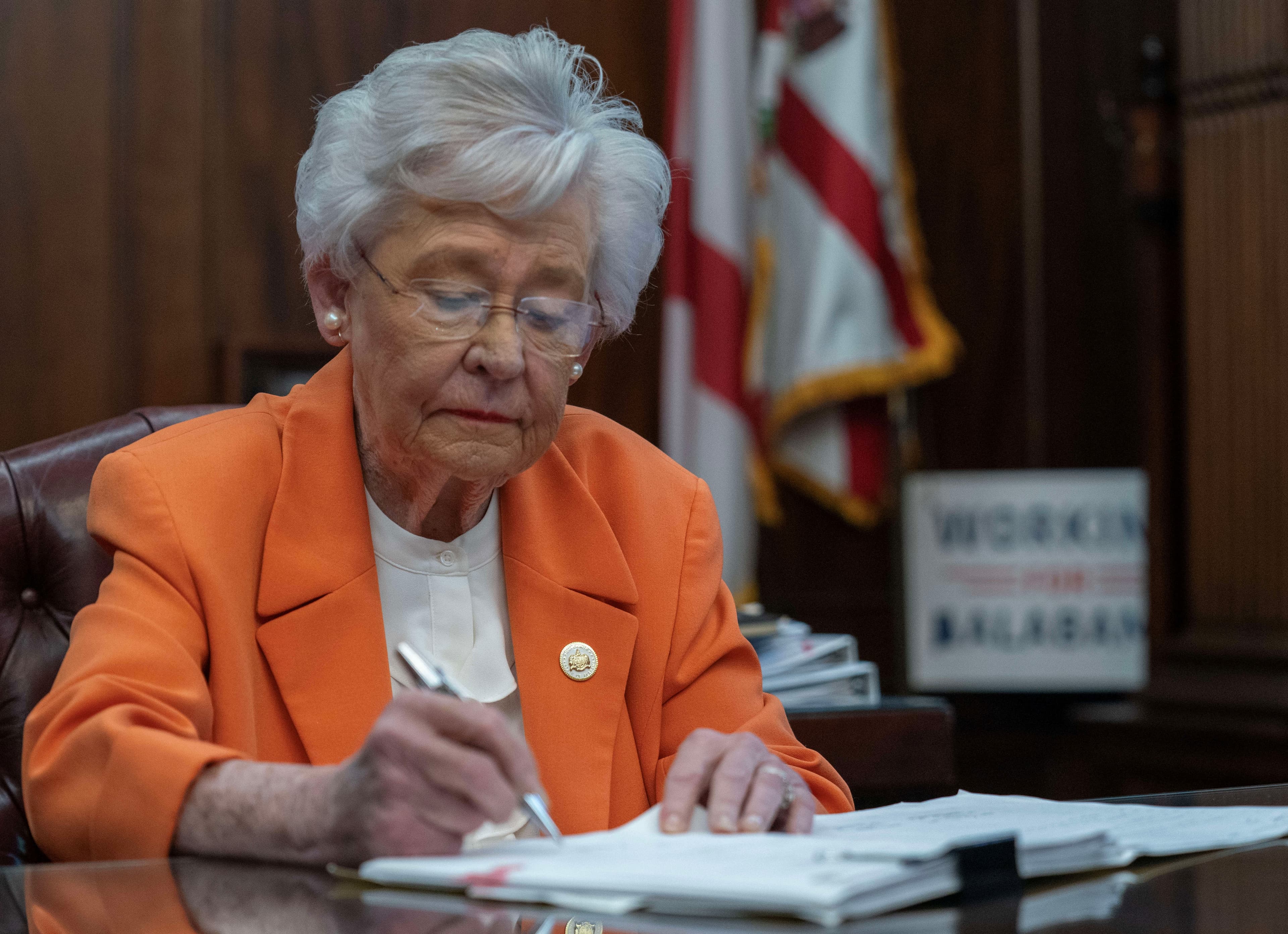 Gov. Kay Ivey signing House Bill 202.
