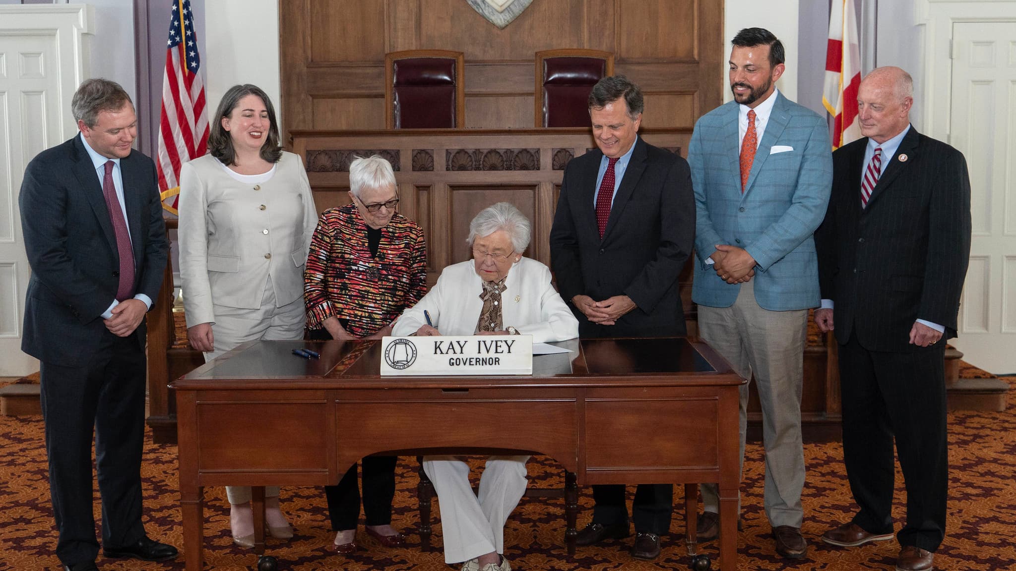 Gov. Kay Ivey is joined by lawmakers and leaders of Alabama Arise on Thursday, June 12, 2025 during a ceremonial signing of HB152. The bill removes the state sales tax on diapers, baby formula and menstrual goods and similar items.