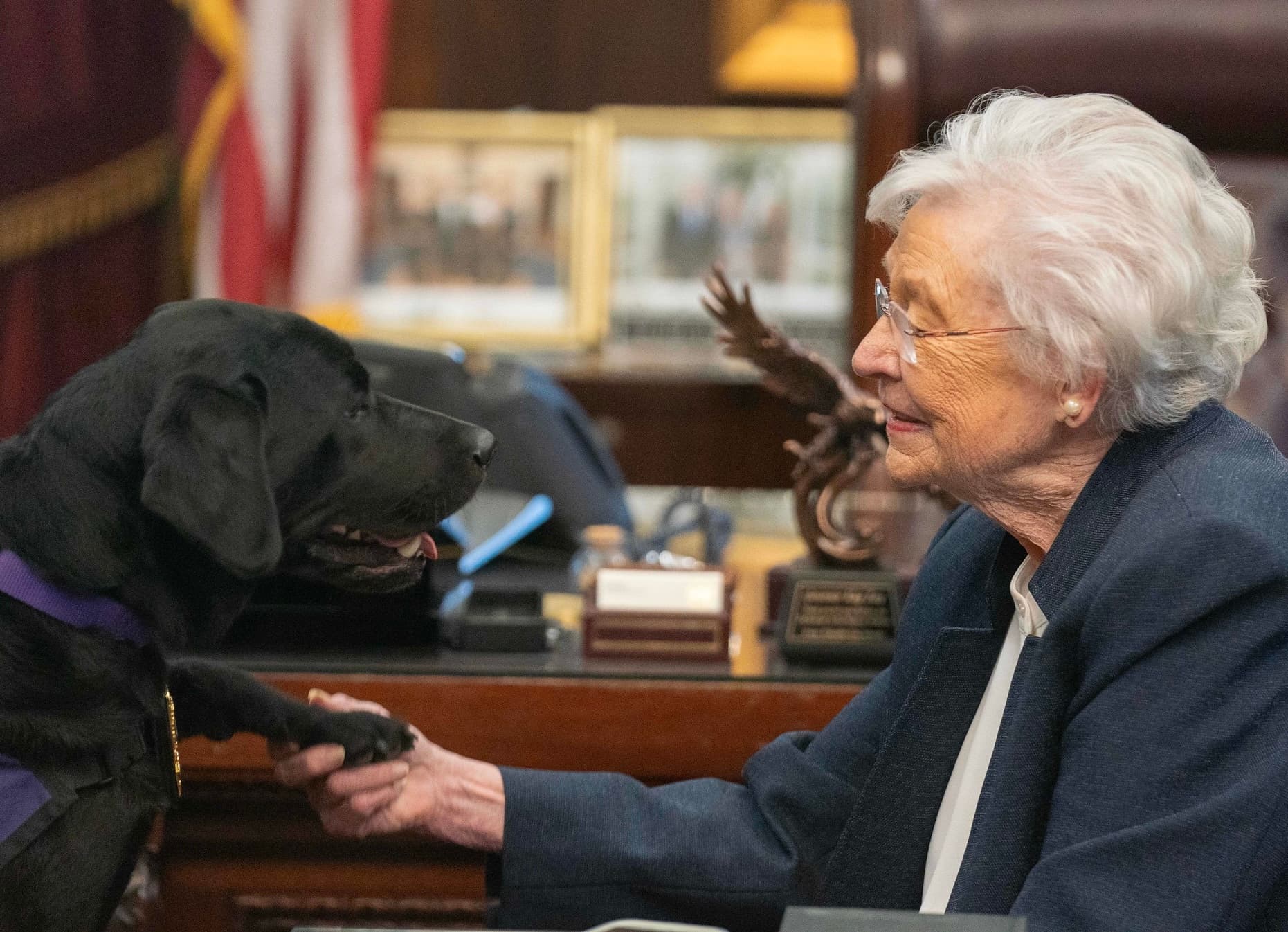 Gov. Kay Ivey and Vaquito, the work zone safety dog.