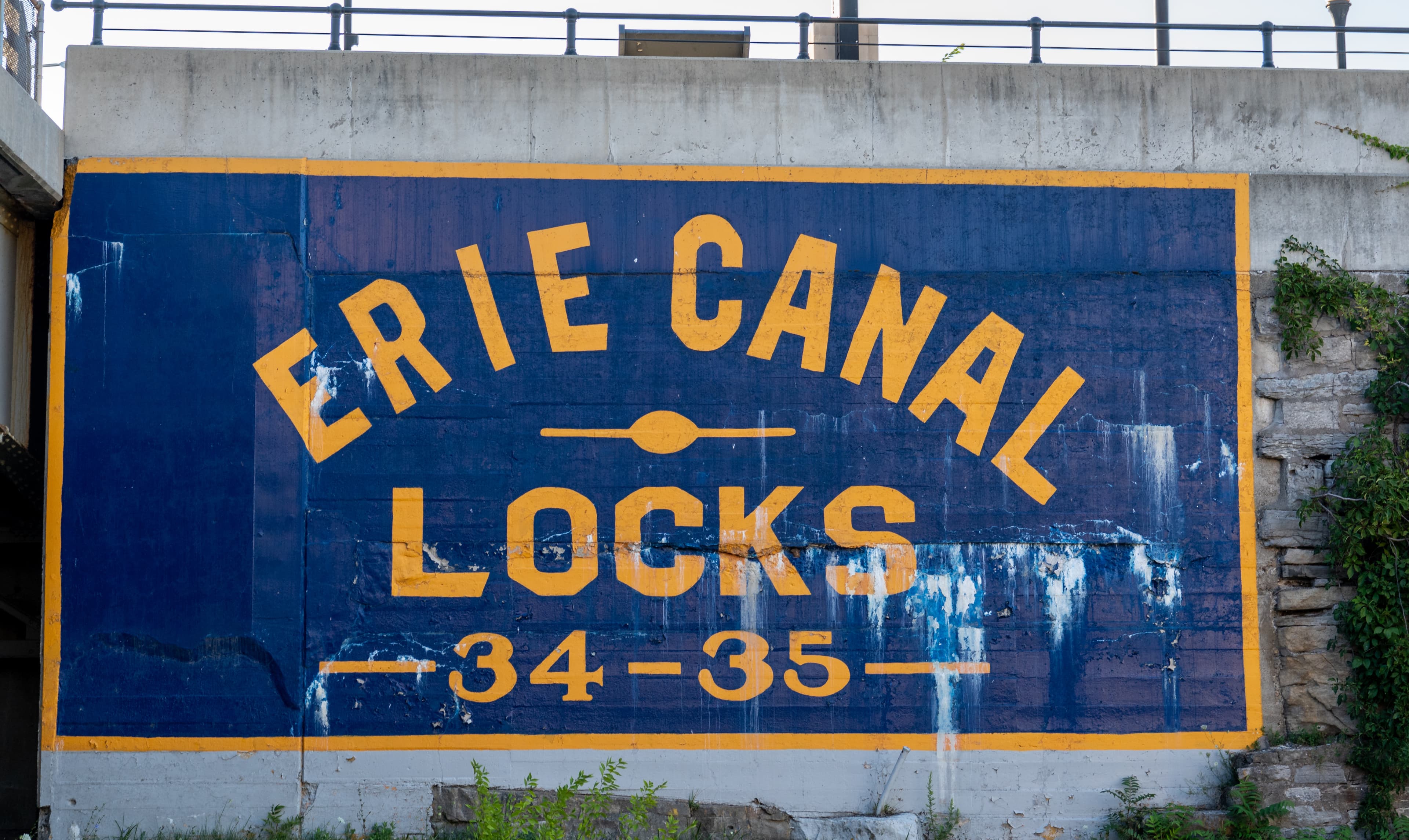 Erie Canal Locks 34-35 sign as viewed from a tour boat on the canal.
