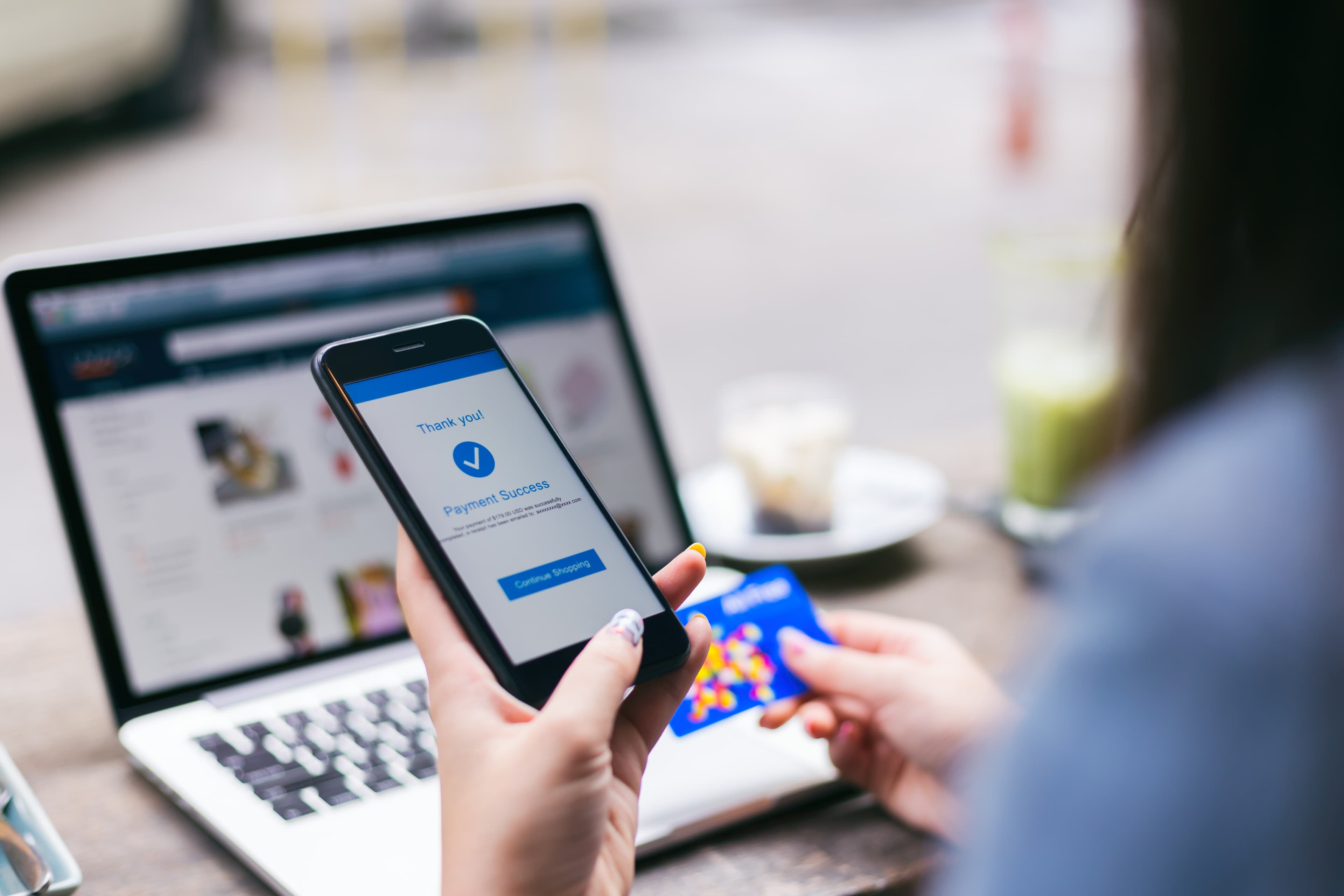 Young asian woman making payment success on mobile smartphone sc