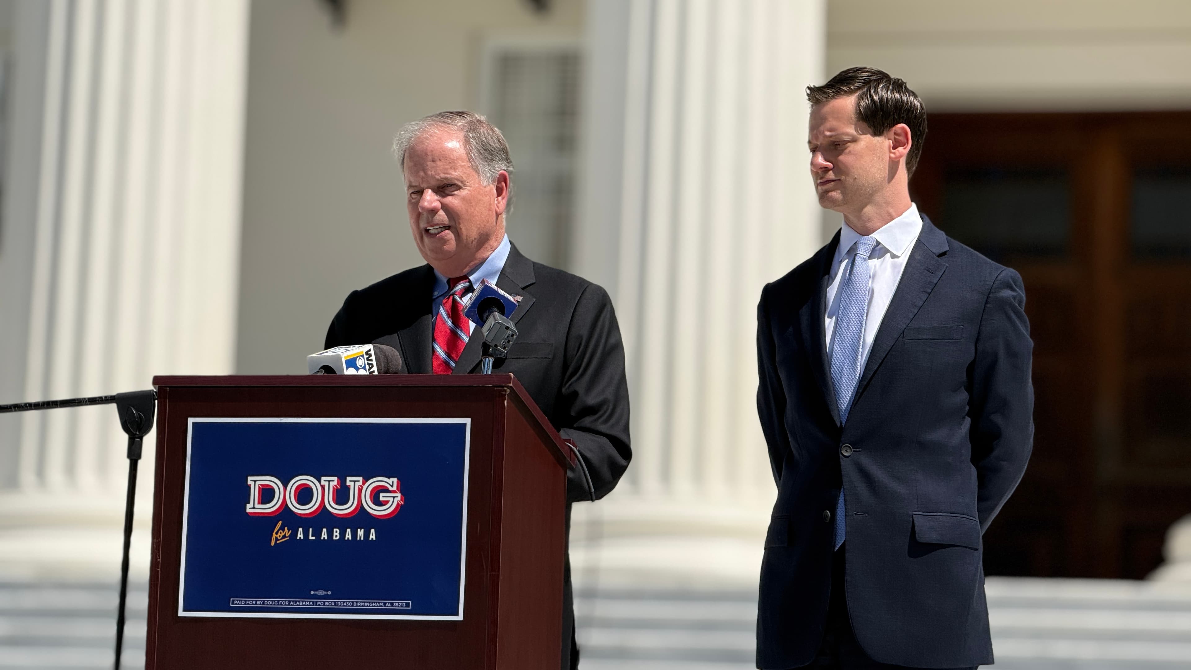Doug Jones and Phillip Ensler announce plans to reshape the office of lieutenant governor outside the state capitol on Wednesday, Sep. 16, 2026. (Jacob Holmes/APR)