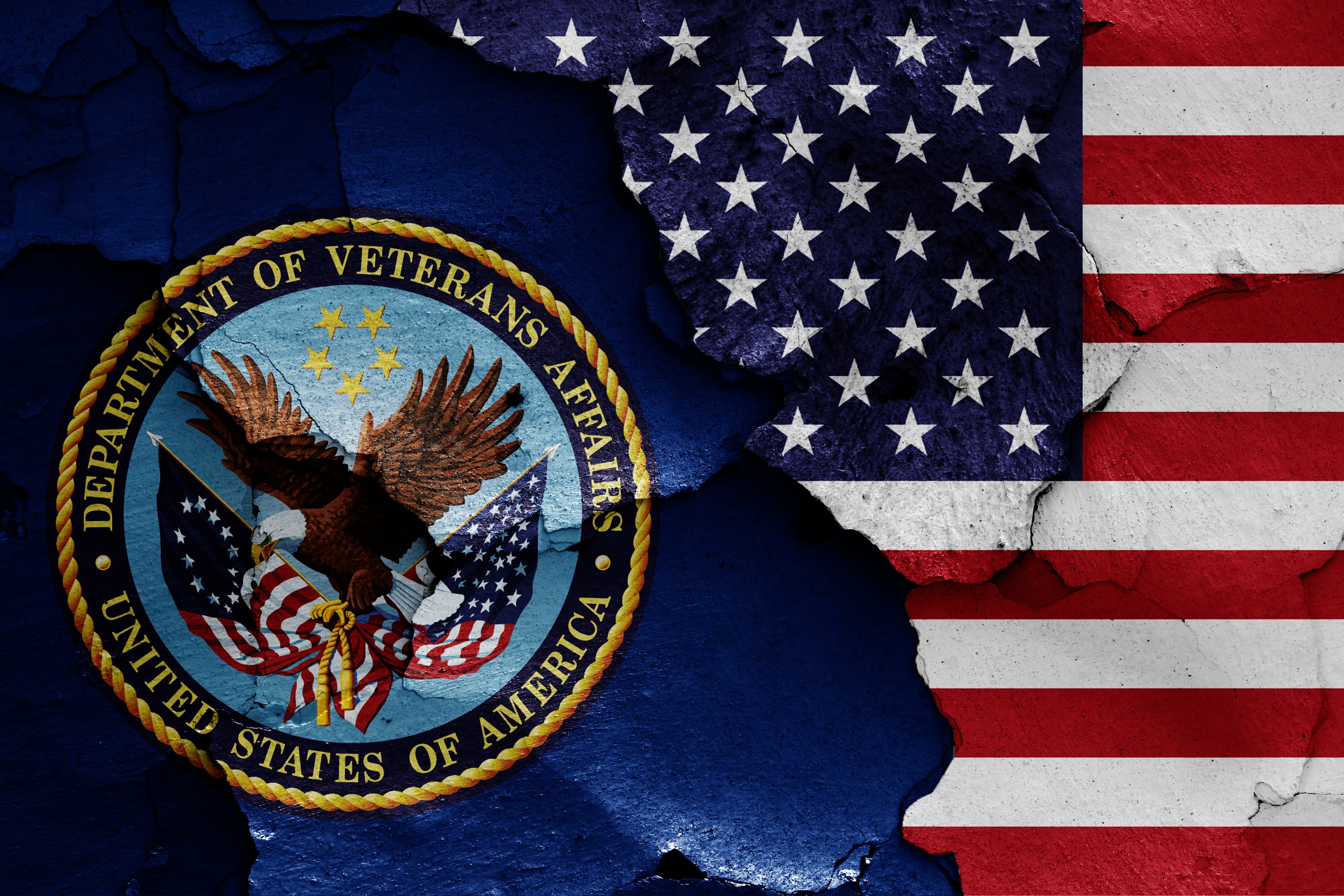 flags of Department of Veterans Affairs and USA painted on cracked wall