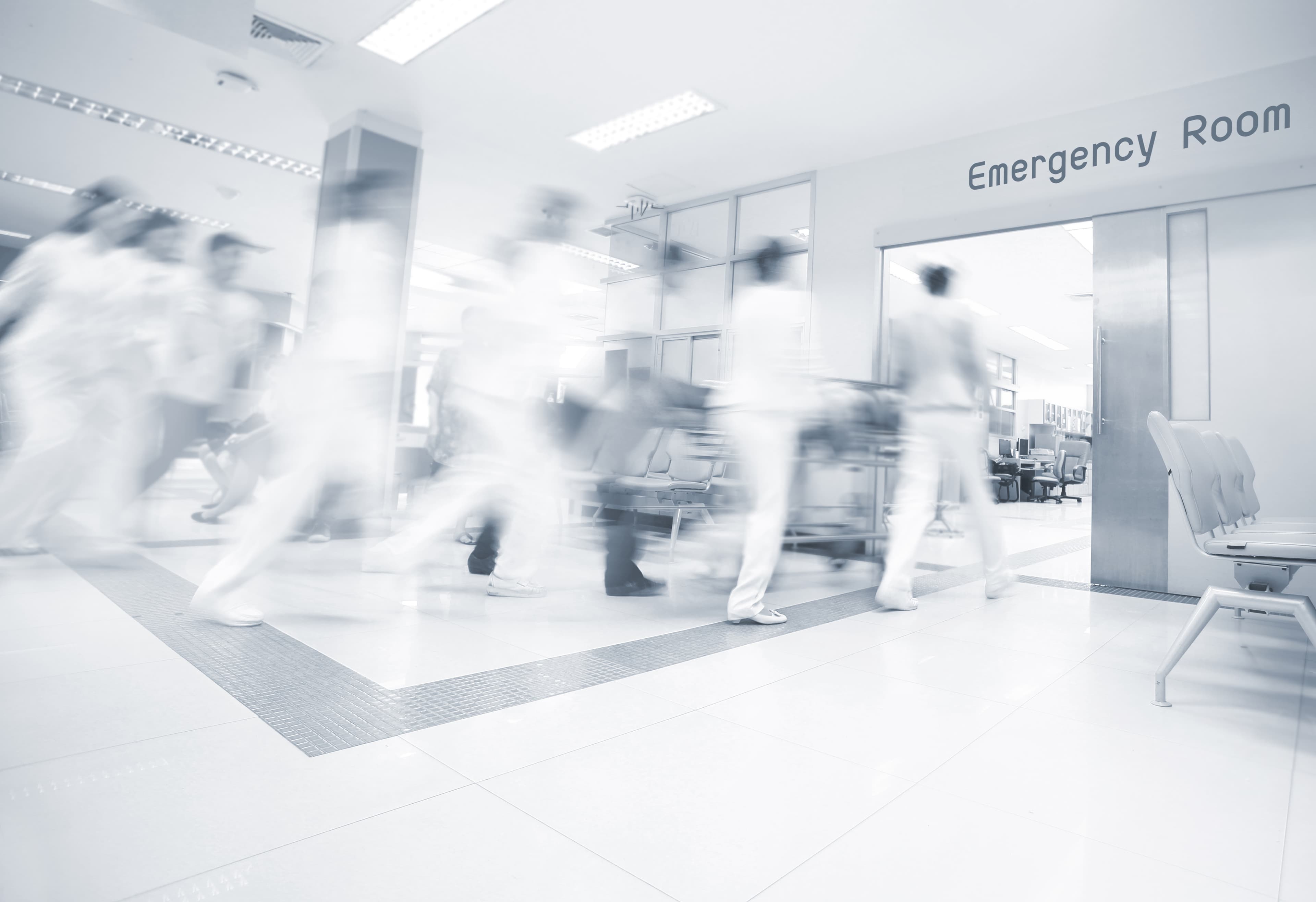 A motion blurred photograph of a patient on stretcher or gurney