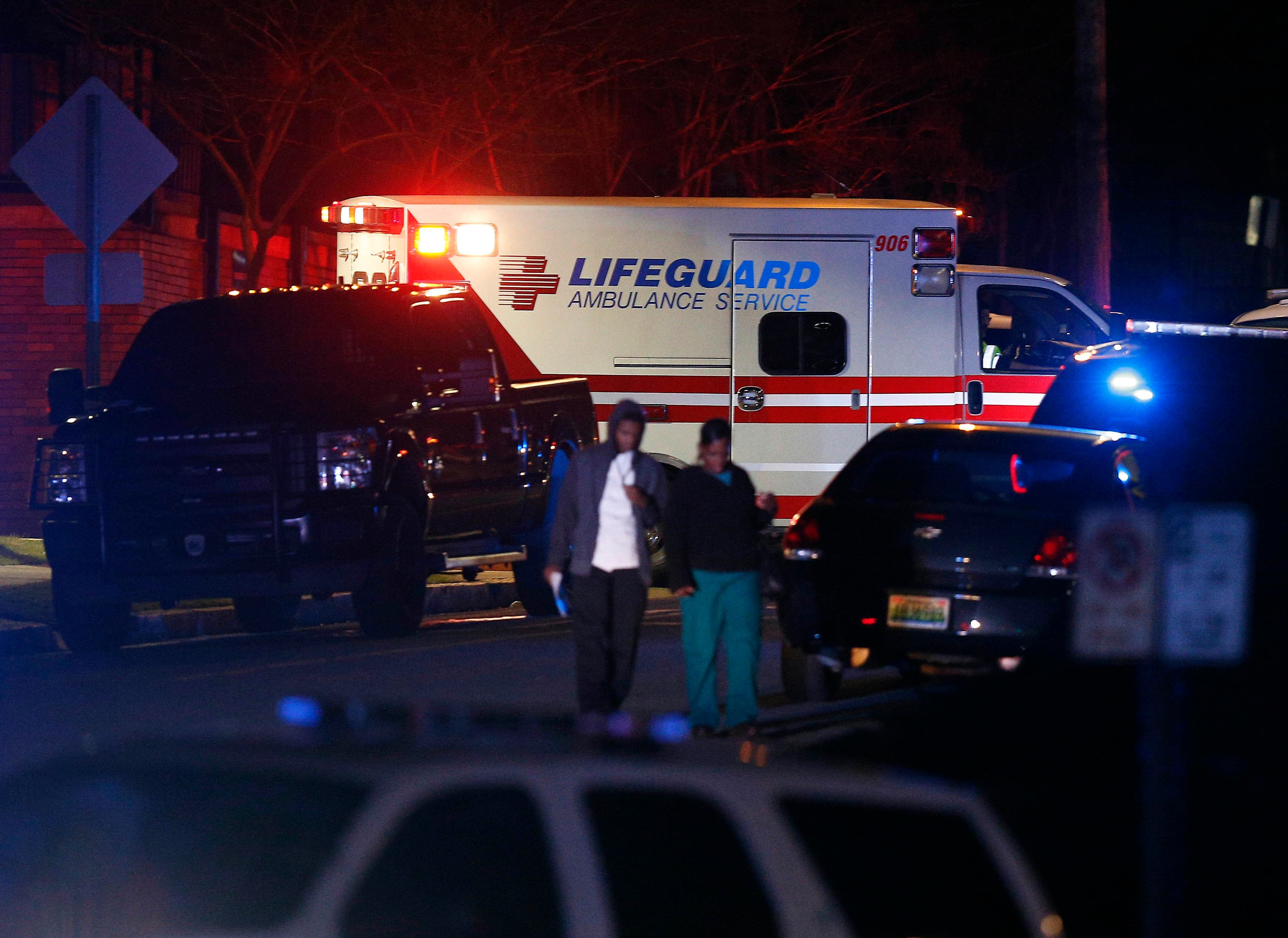 An ambulance arrives as authorities respond to a gunman that opened fire at a Birmingham, Alabama, hospital, wounding two men before turning the gun on himself Wednesday night, police said, on Wednesday, March 14, 2018, in Birmingham, Ala. (AP Photo/Brynn Anderson)