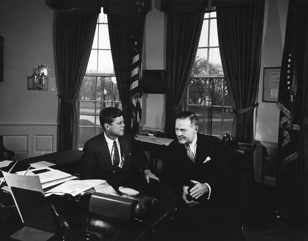 President John F. Kennedy meets with Director General of the Atlantic Institute, Henry Cabot Lodge, in the Oval Office, White House, Washington, D.C., 1961.